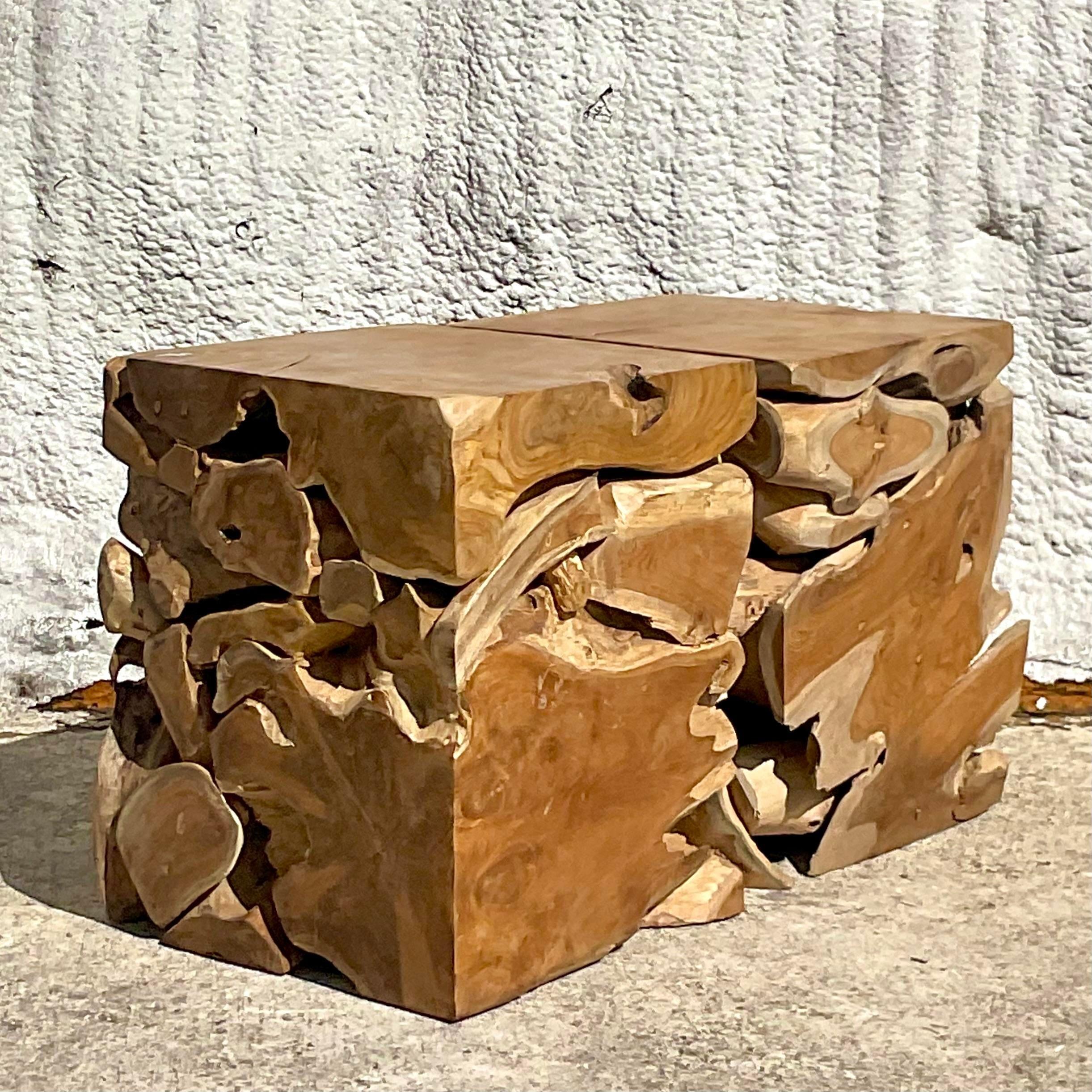 This pair of vintage Boho puzzle wood stools features a unique, interlocking design with a rustic charm, perfect for adding a touch of eclectic flair to any space