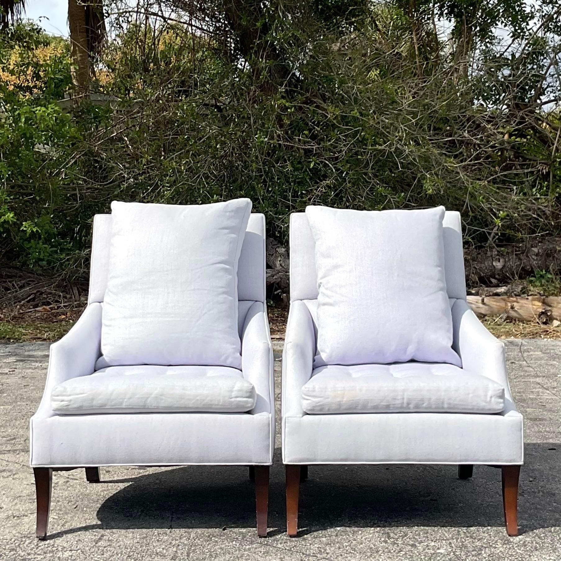 A fabulous pair of vintage Boho lounge chairs. Made by the iconic R. Jones group and tagged under the seat. Beautiful curved shape and high back. A chic loose cushion for extra comfort. Acquired from a Palm Beach estate