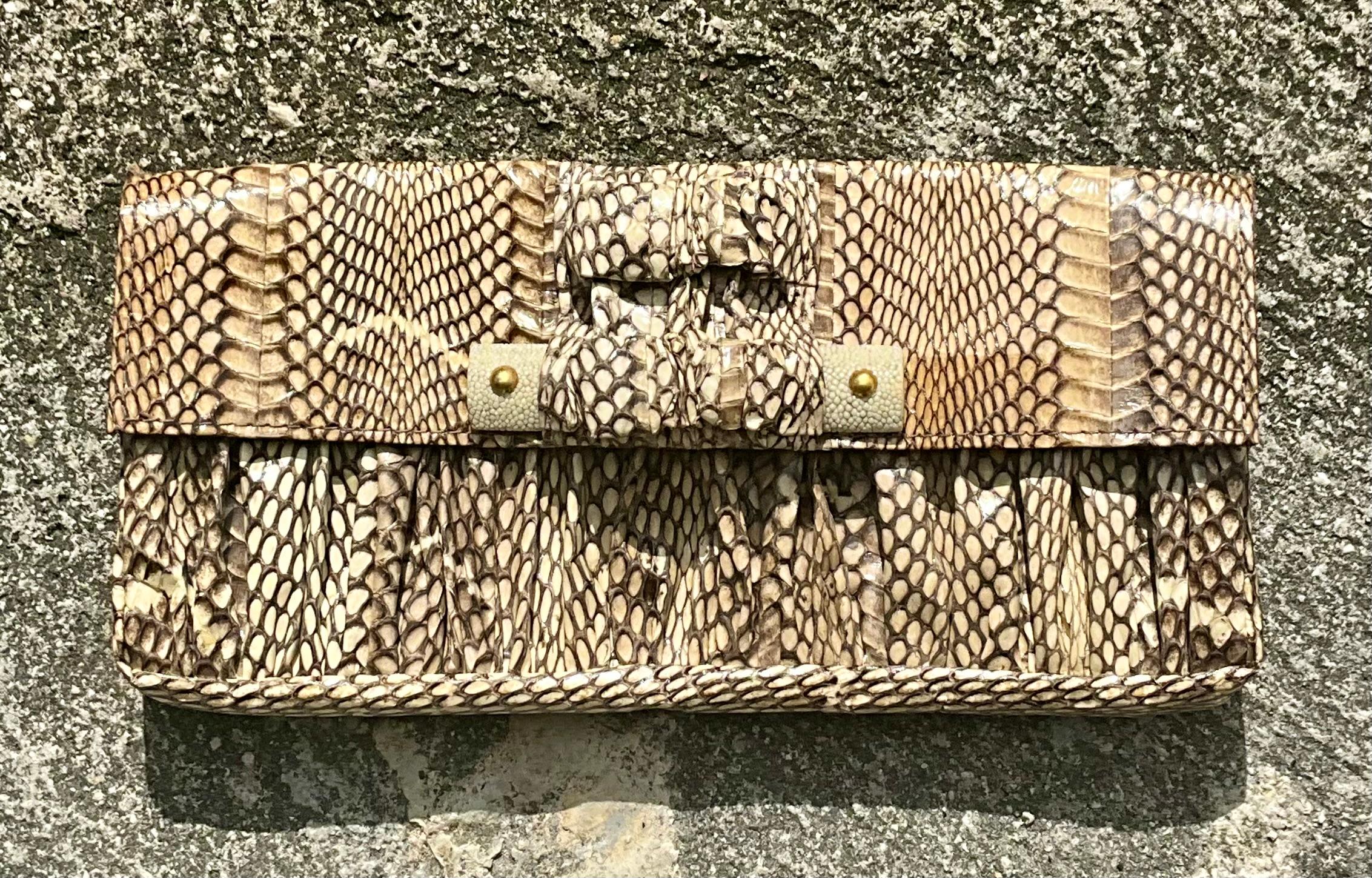 A Vintage Boho R & Y Augousti Snake Skin Clutch Purse is a luxurious, timeless accessory that blends exotic appeal with bohemian sophistication. Known for their craftsmanship, R & Y Augousti designs are celebrated for unique textures, quality