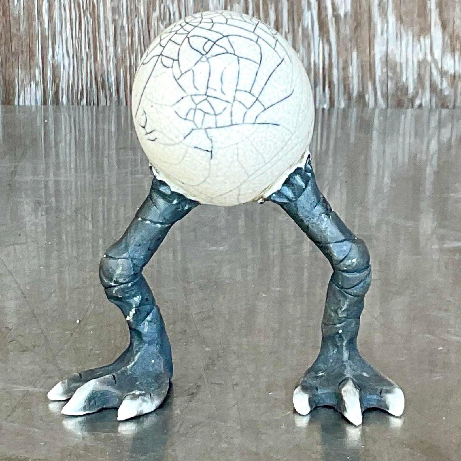 A fantastic vintage Boho sculpture. A chic little egg shaped creature on long legs. Adorable. A great way to add a flash of whimsey to any etagere or coffee table. Acquired from a Palm Beach estate. 