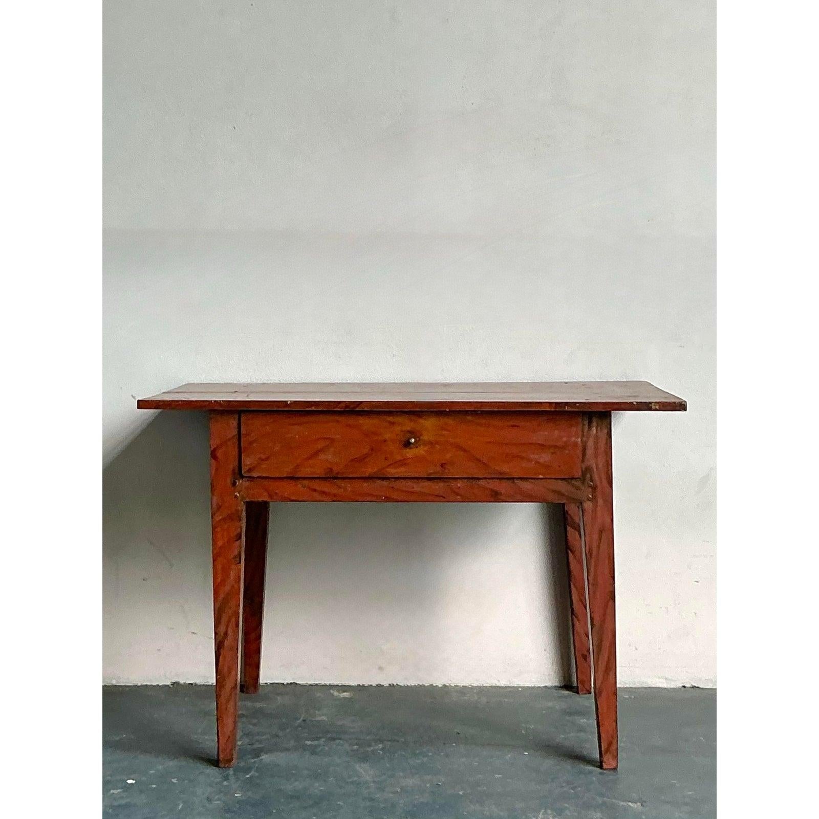 Embrace the charm of salvaged materials with this unique vintage Boho console table, expertly crafted from reclaimed wood. Each imperfection and unique grain pattern tells a story, contributing to the table's authentic character and rustic appeal.
