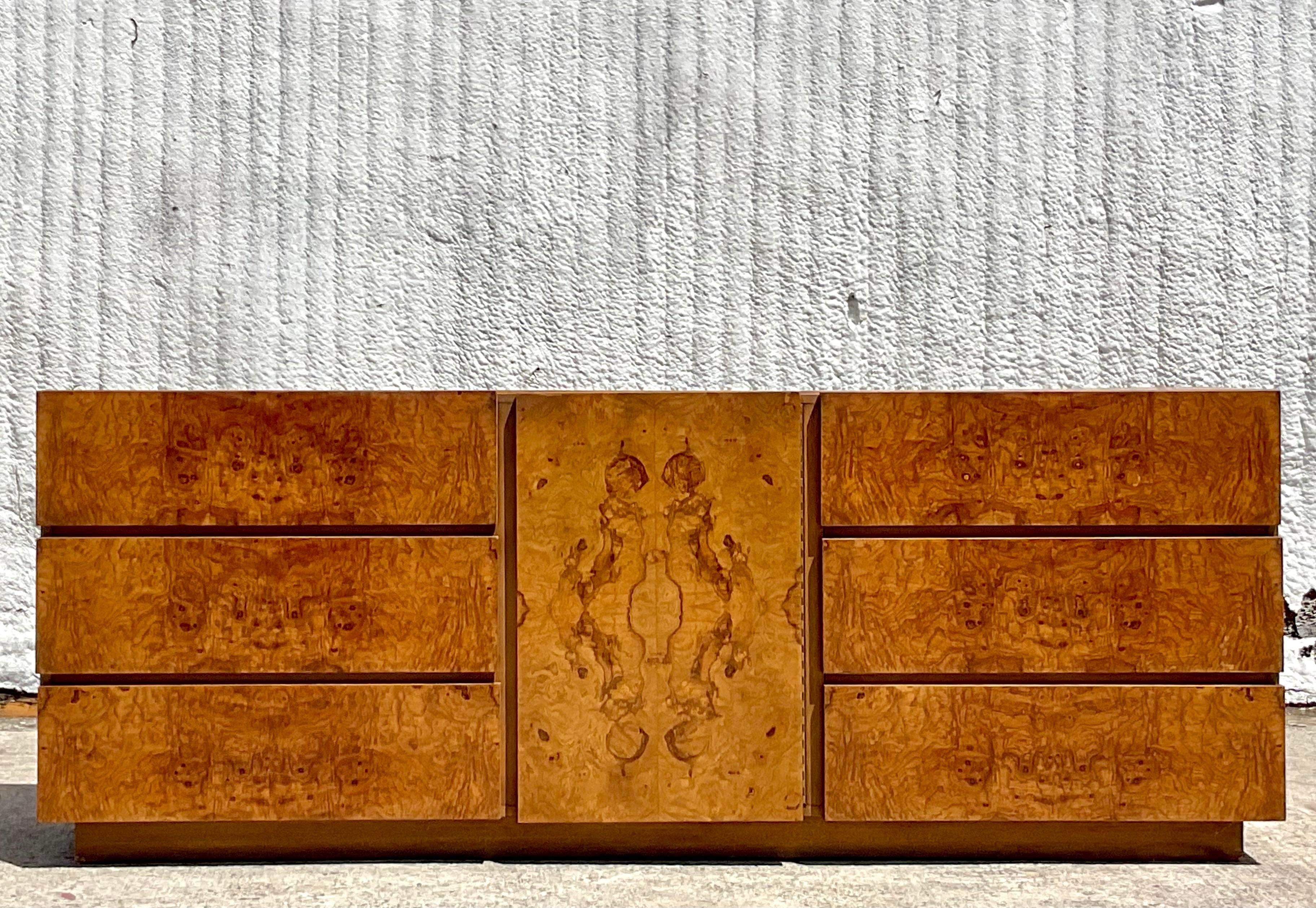 An exceptional vintage Boho credenza. Designed by the iconic Roland Carter for Lane Furniture. Beautiful wood grain detail with lots of great storage. Signed inside the top drawer. Acquired from a Palm Beach estate.