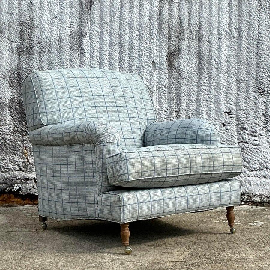 Relax in style with this vintage boho roll arm lounge chair, featuring elegantly curved arms and a timeless silhouette. Its plush seat and backrest offer exceptional comfort, while the detailed craftsmanship exudes bohemian charm. Perfect for living