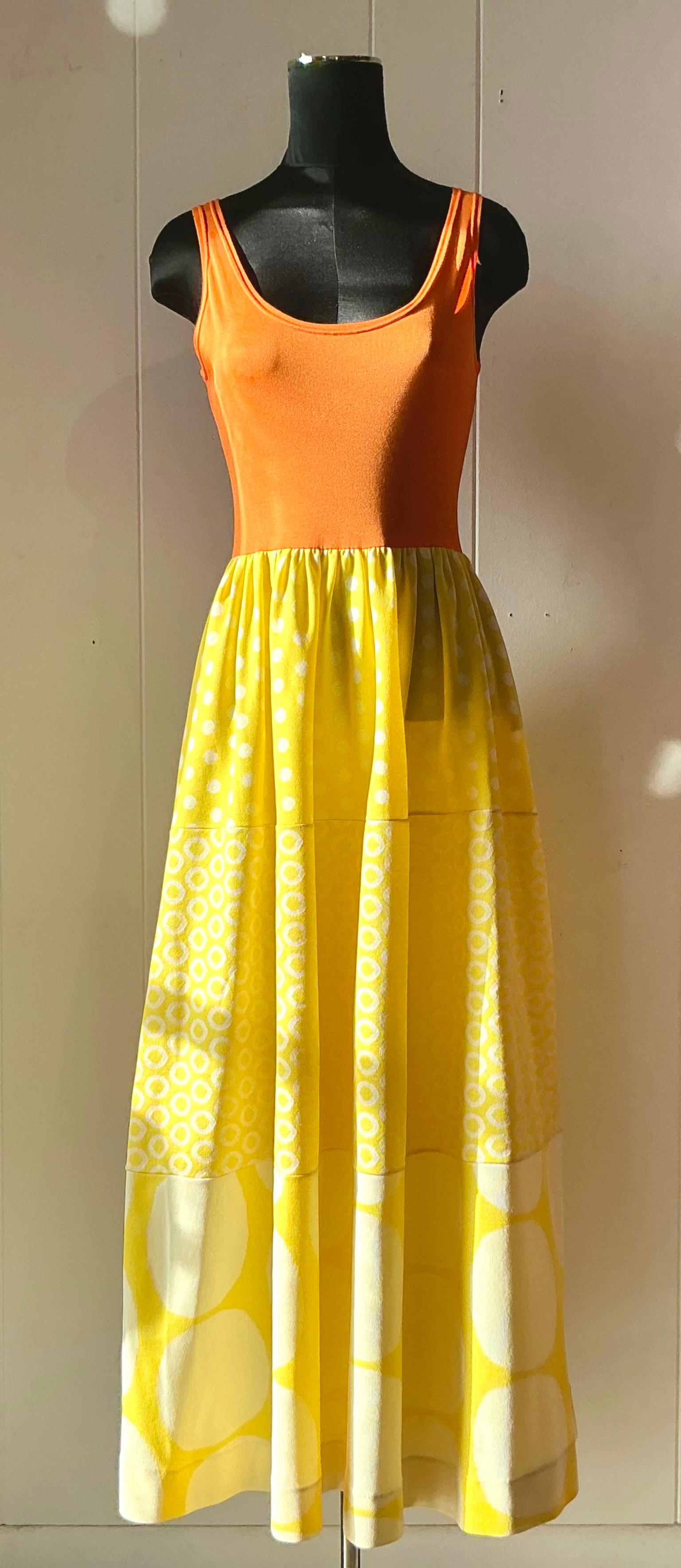 This vintage boho Rudi Gernreich dress is a bold and vibrant expression of 1960s and 70s avant-garde fashion. Featuring a striking orange and yellow color palette, the dress reflects Gernreich’s fearless use of color and commitment to breaking