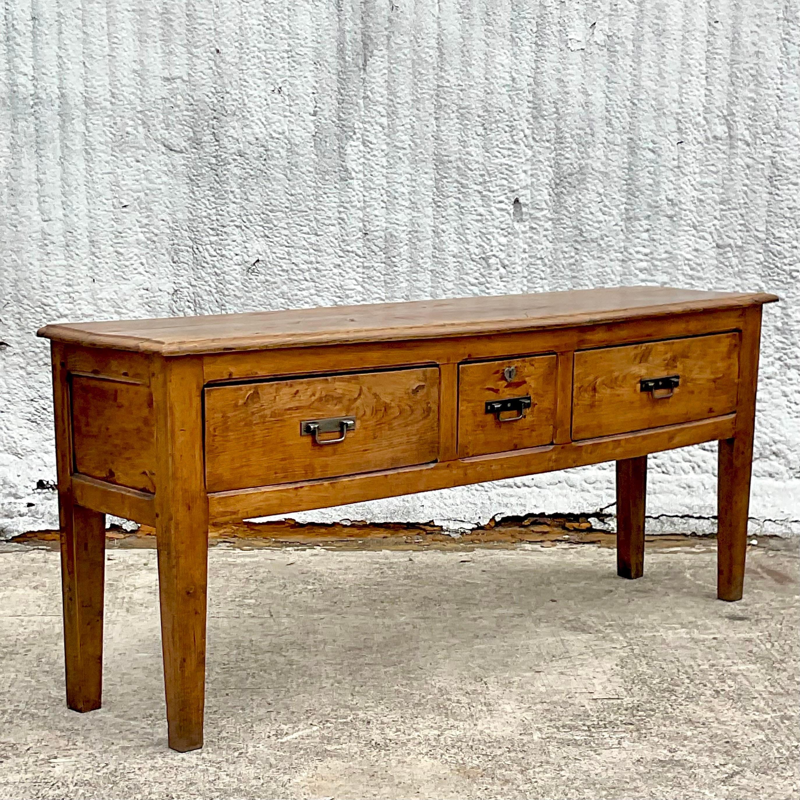 A stunning vintage Boho sideboard. A beautiful rustic frame that has been fully restored to its former glory. Perfect as a sideboard, but also beautiful as a console table. Lots of great storage. Acquired from a Palm Beach estate.