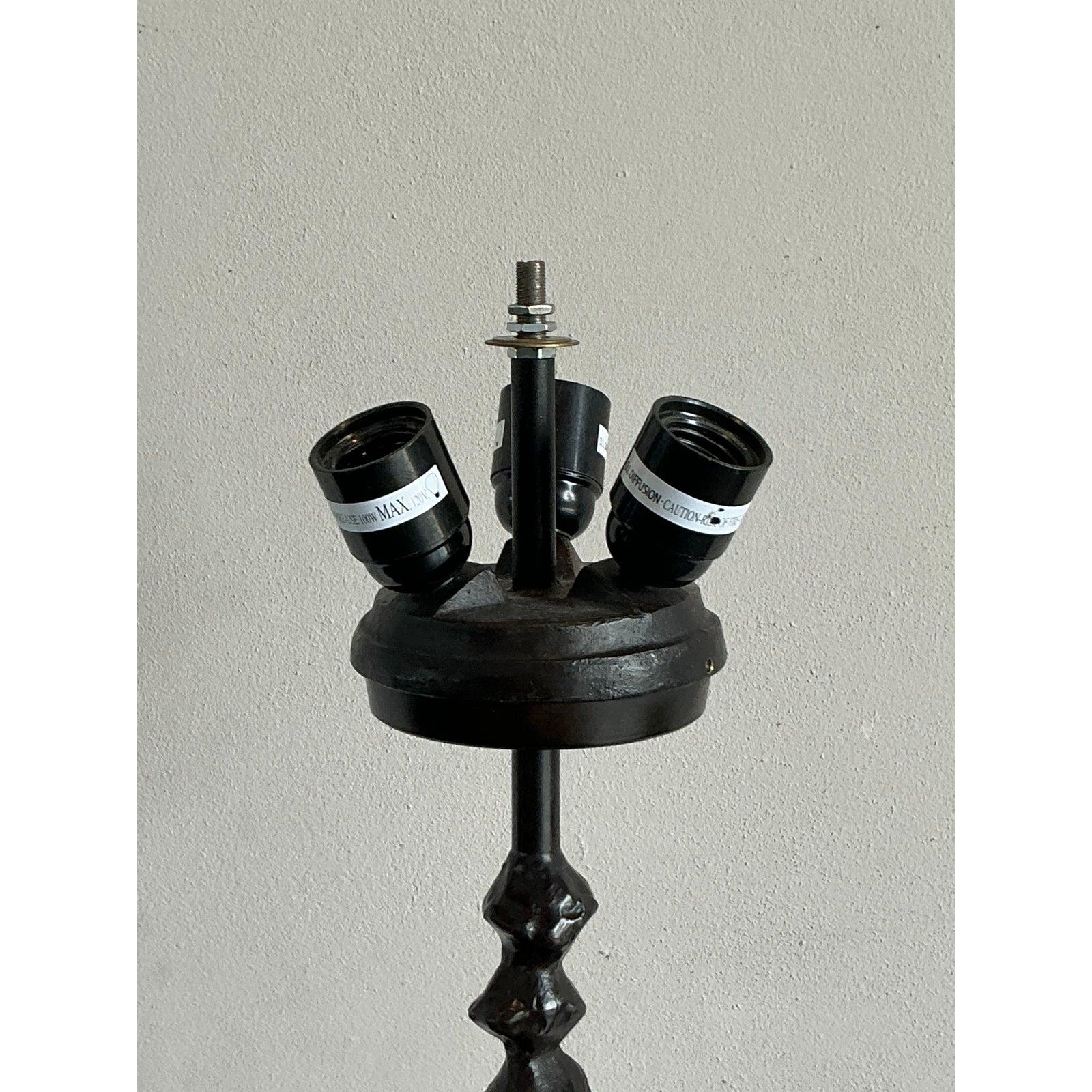 Presenting a captivating vintage floor lamp, strongly echoing the raw, evocative aesthetic of Alberto Giacometti's sculptural works. This piece features a distinctively sculpted, dark wood body, resembling stacked organic forms or totemic carvings,