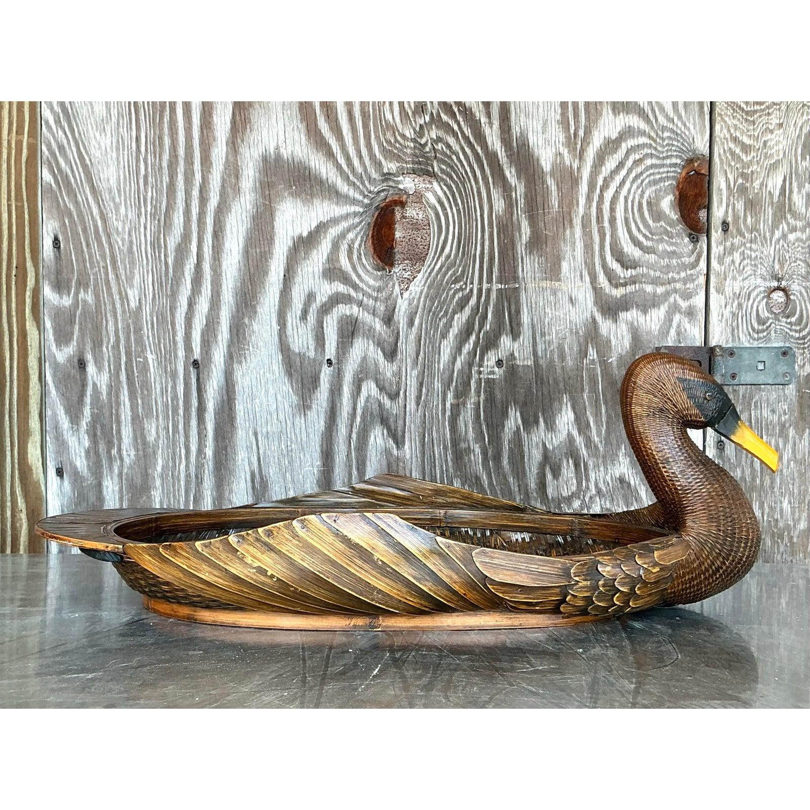 Imbue your living space with the whimsical charm of this vintage bohemian Shanghai weave duck basket. Masterfully hand-woven, this unique piece showcases intricate craftsmanship through its distinctive 