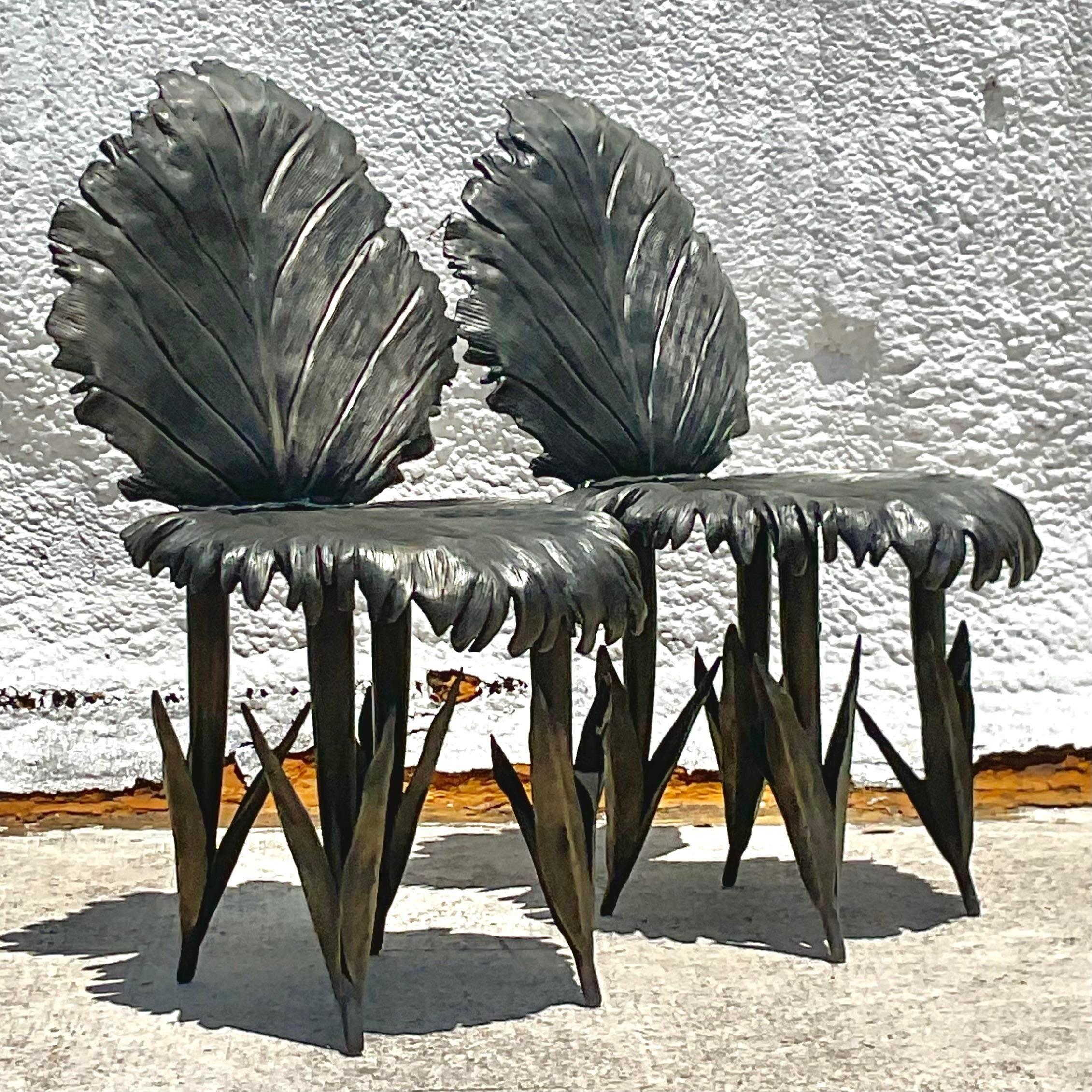 An extraordinary pair of Boho side chairs. Hand forged in bronze and signed and dated by the artist. An incredible leaf design with incredible movement. Acquired from a Palm Beach estate.