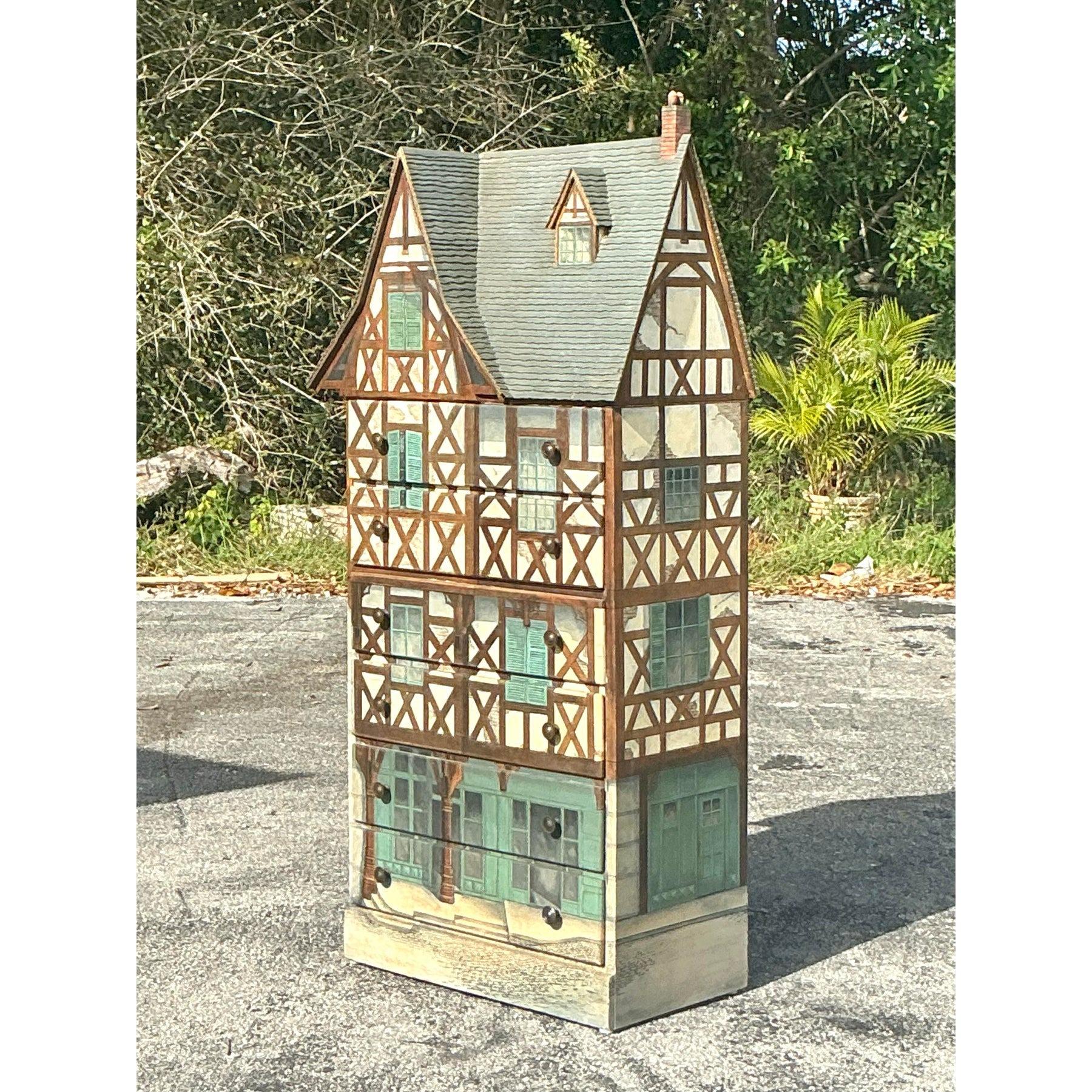 A true statement piece, this signed Carolyn Wernimont Tudor house chest of drawers brings whimsical charm and functional storage together. Hand-painted in exquisite detail, this chest mimics the look of a classic Tudor-style home, complete with