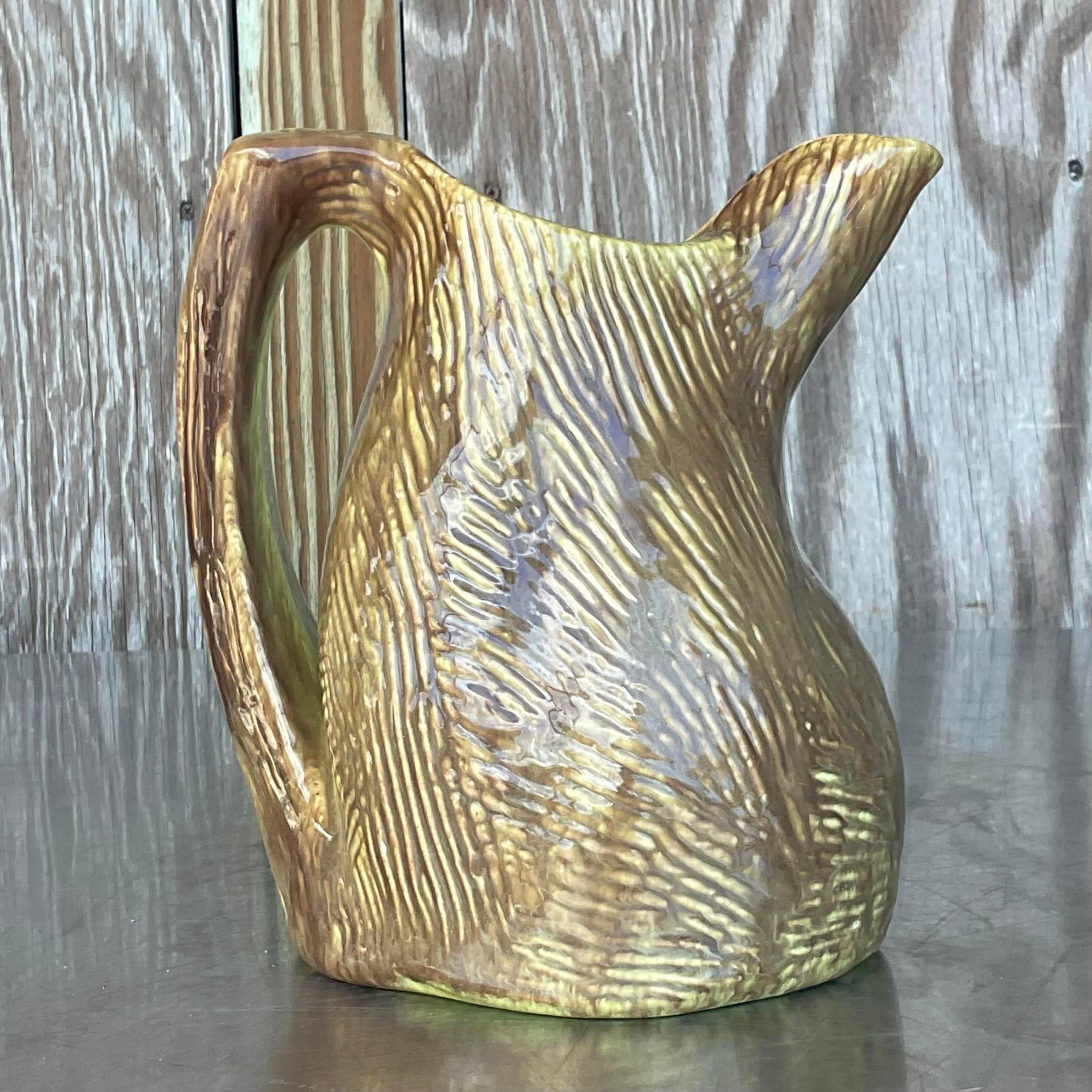 A fabulous vintage Boho pitcher. A chic studio pottery piece that is marked on the bottom. An almost Faux Bois design in brown and chartreuse. Acquired from a Palm Beach estate. 