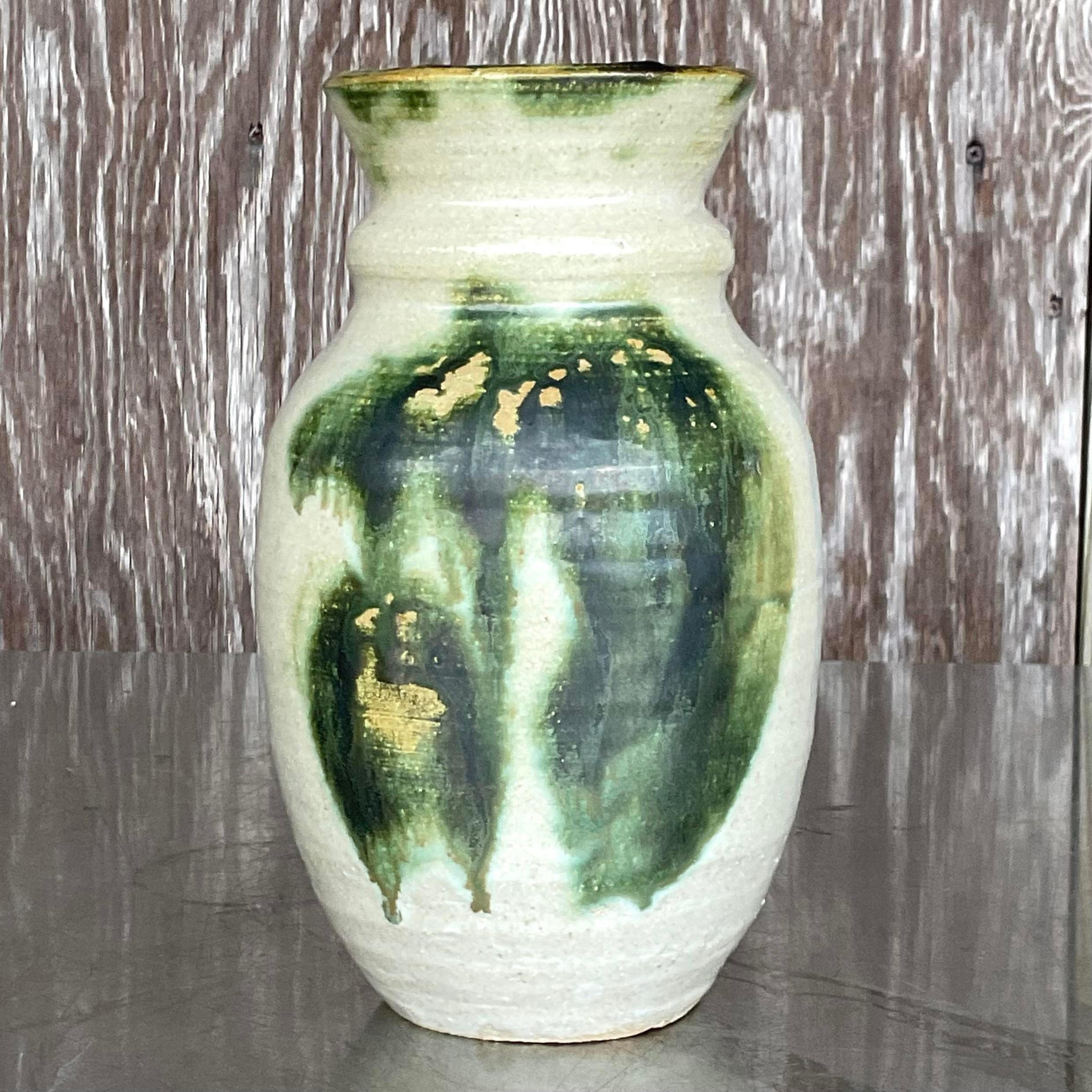 A stunning vintage Boho vase. A chic studio pottery piece with hand painted detail. Signed on the bottom. Acquired from a Ft Lauderdale estate.
