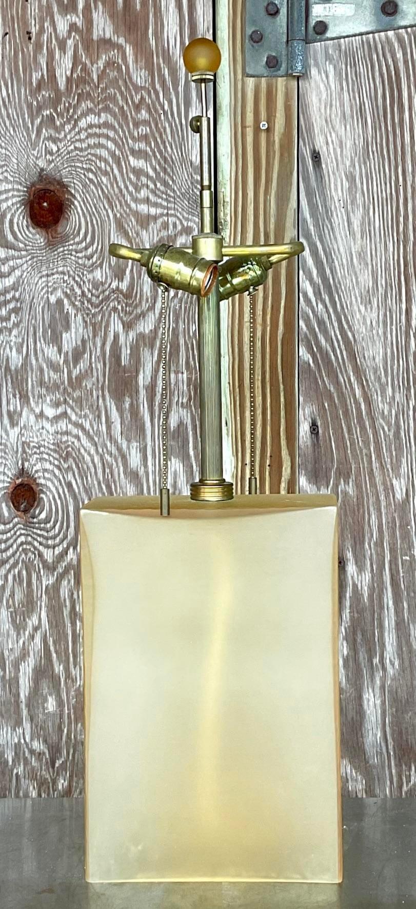 A stunning vintage Boho table lamp. A chic heavy frosted glass with a chic Amber hue. Done by the iconic John Hutton and signed on the back. Acquired from a Palm Beach estate