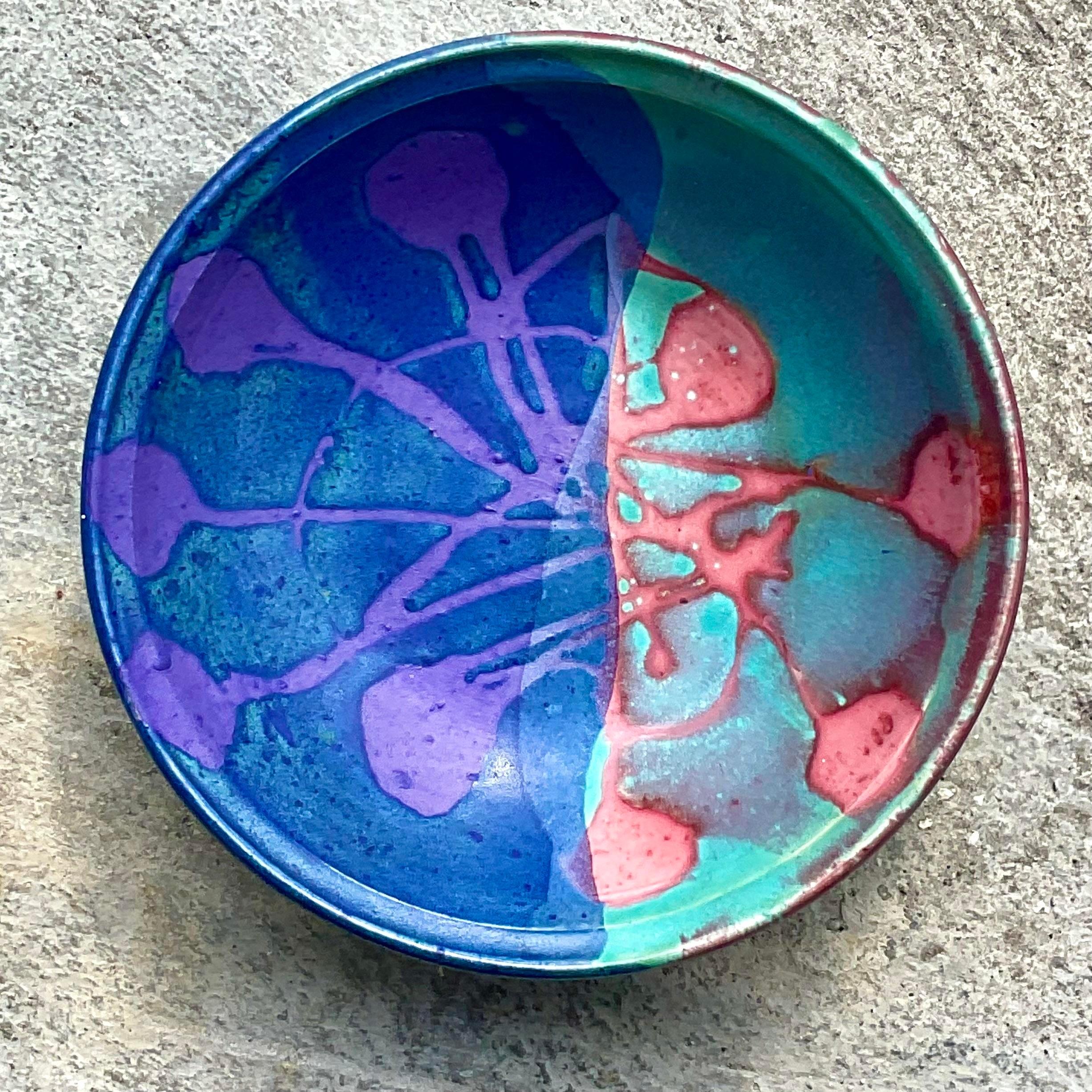 A fantastic vintage Boho studio pottery bowl. Brilliant colors dominate this piece. Fabulous biomorphic design. Acquired from a Palm Beach estate. 