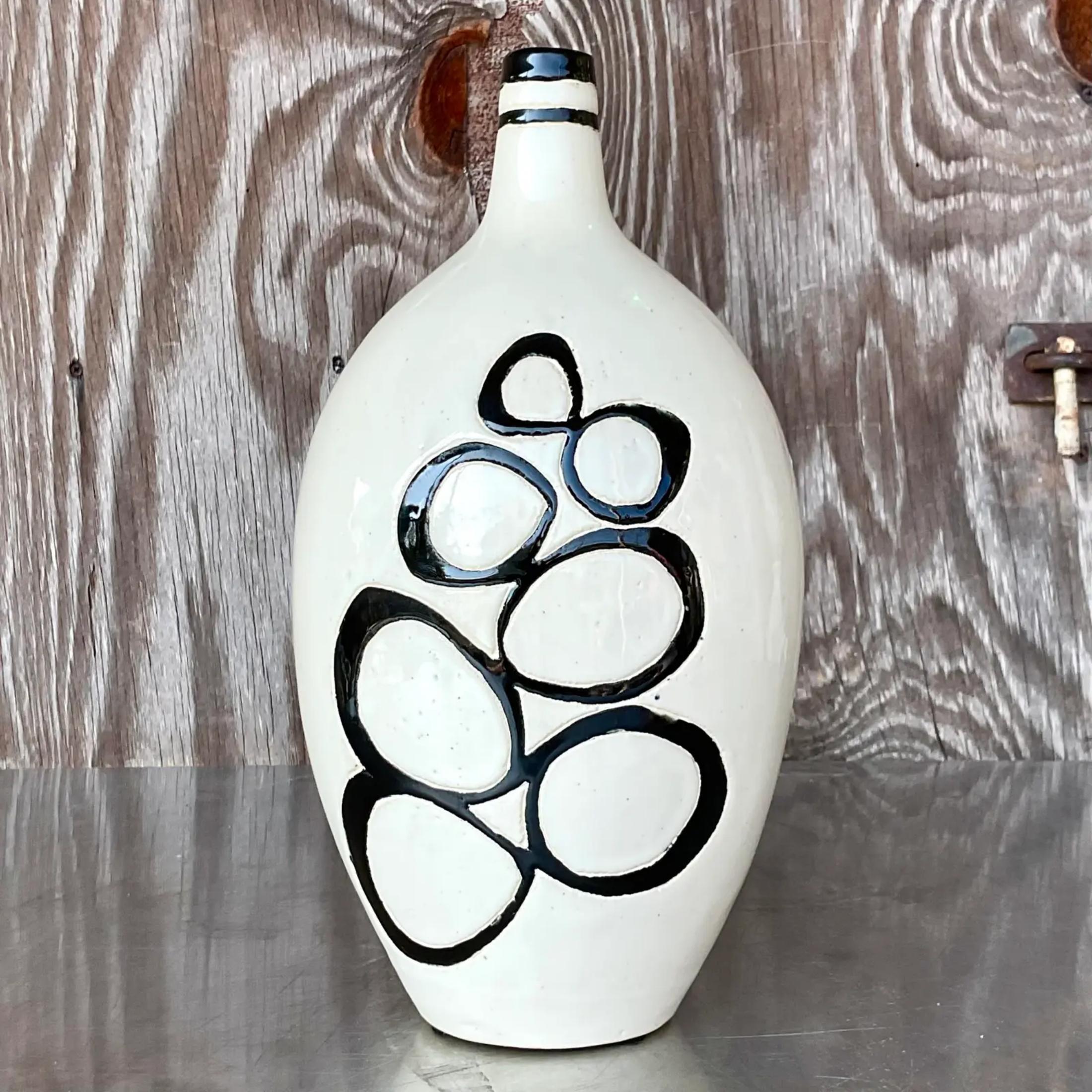 A fabulous vintage Boho pottery vase. A chic studio piece with hand carved bubbles on each side. Acquired from a Palm Beach estate