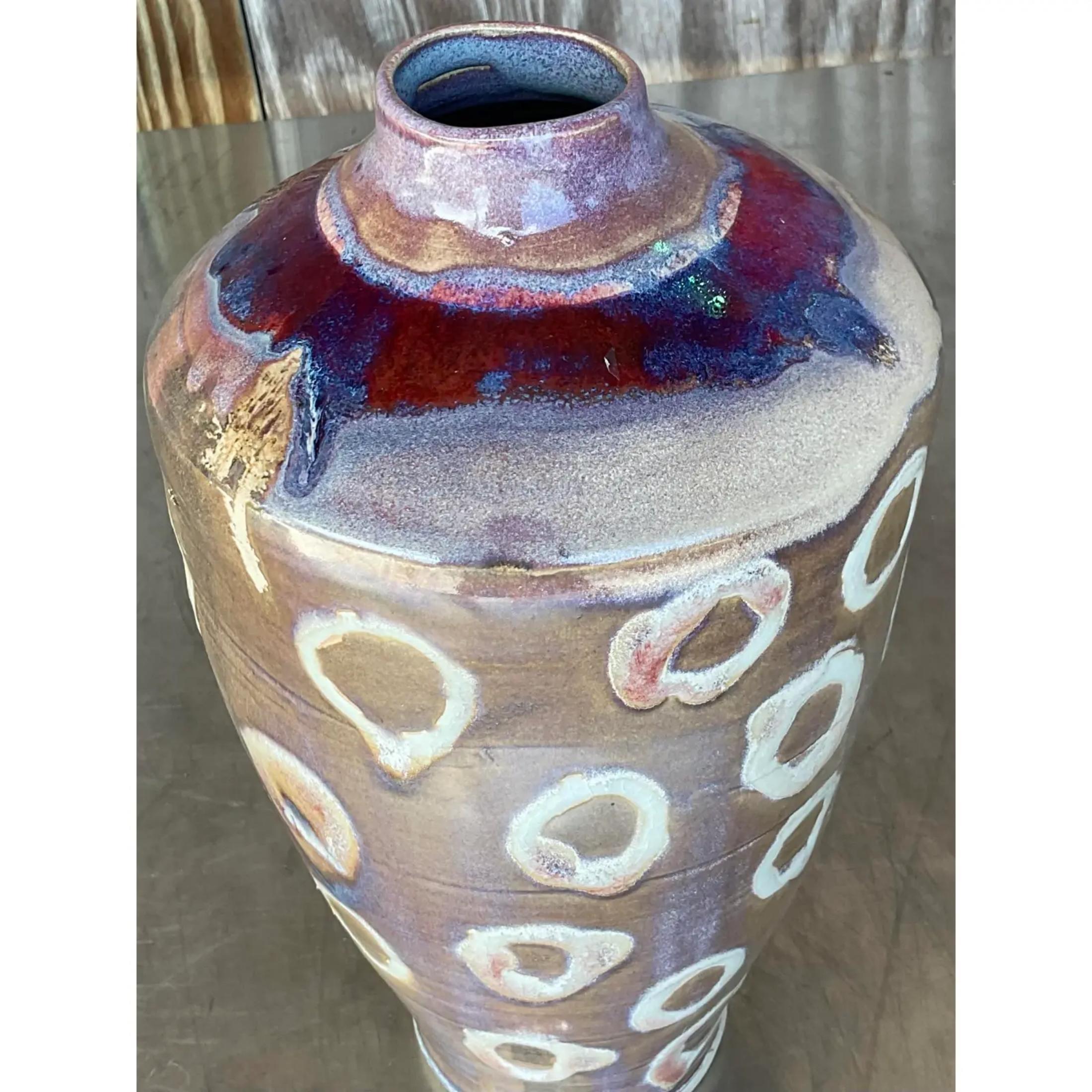 An exceptional vintage Boho signed studio pottery vase. A chic hand painted piece with beautiful colors. Signed on the bottom. Acquired from a Palm Beach estate
