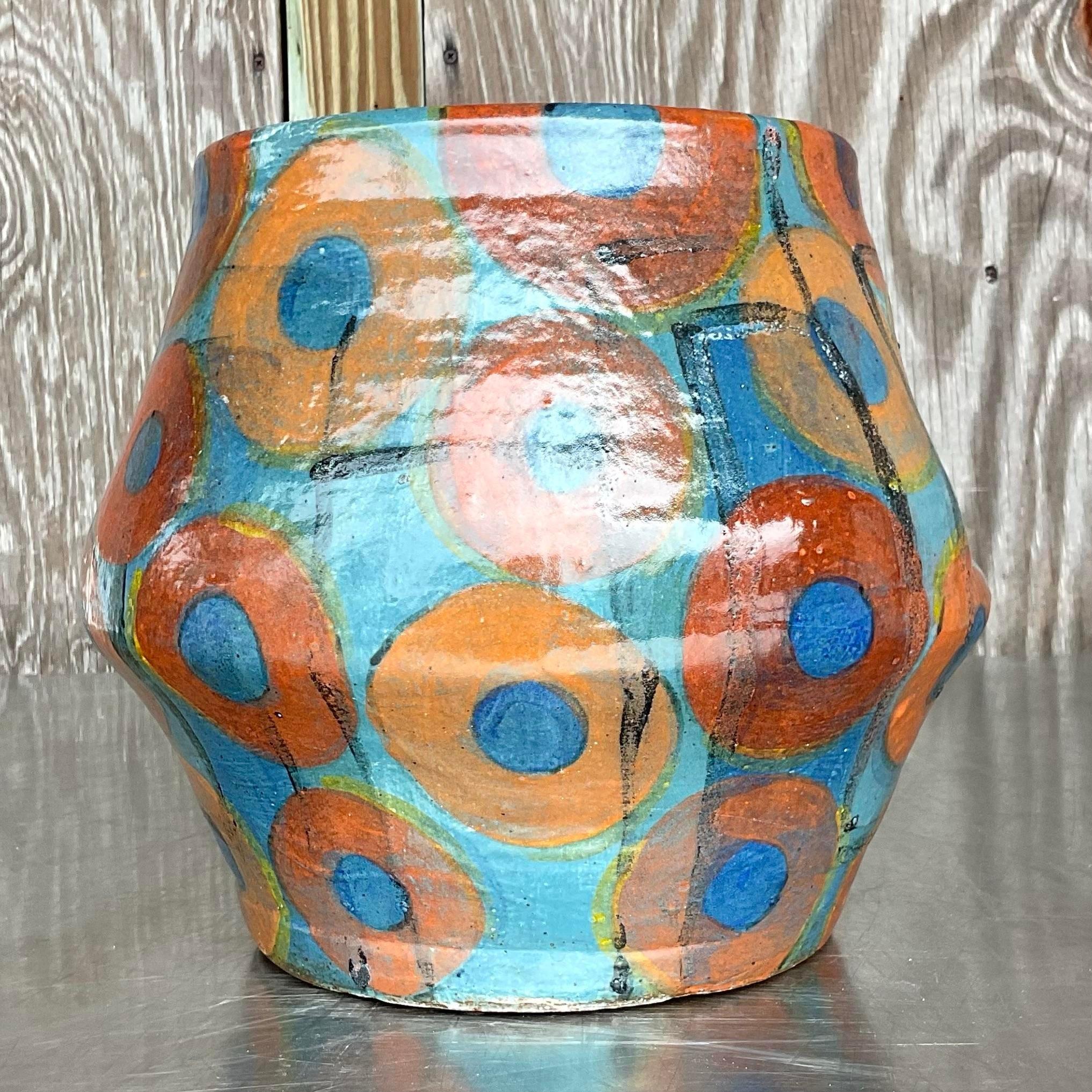 Embrace eclectic charm with this vintage boho signed studio pottery vase, a true testament to American craftsmanship. Each curve and glaze tells a story of artistic expression, adding a touch of character and warmth to any space. Elevate your decor