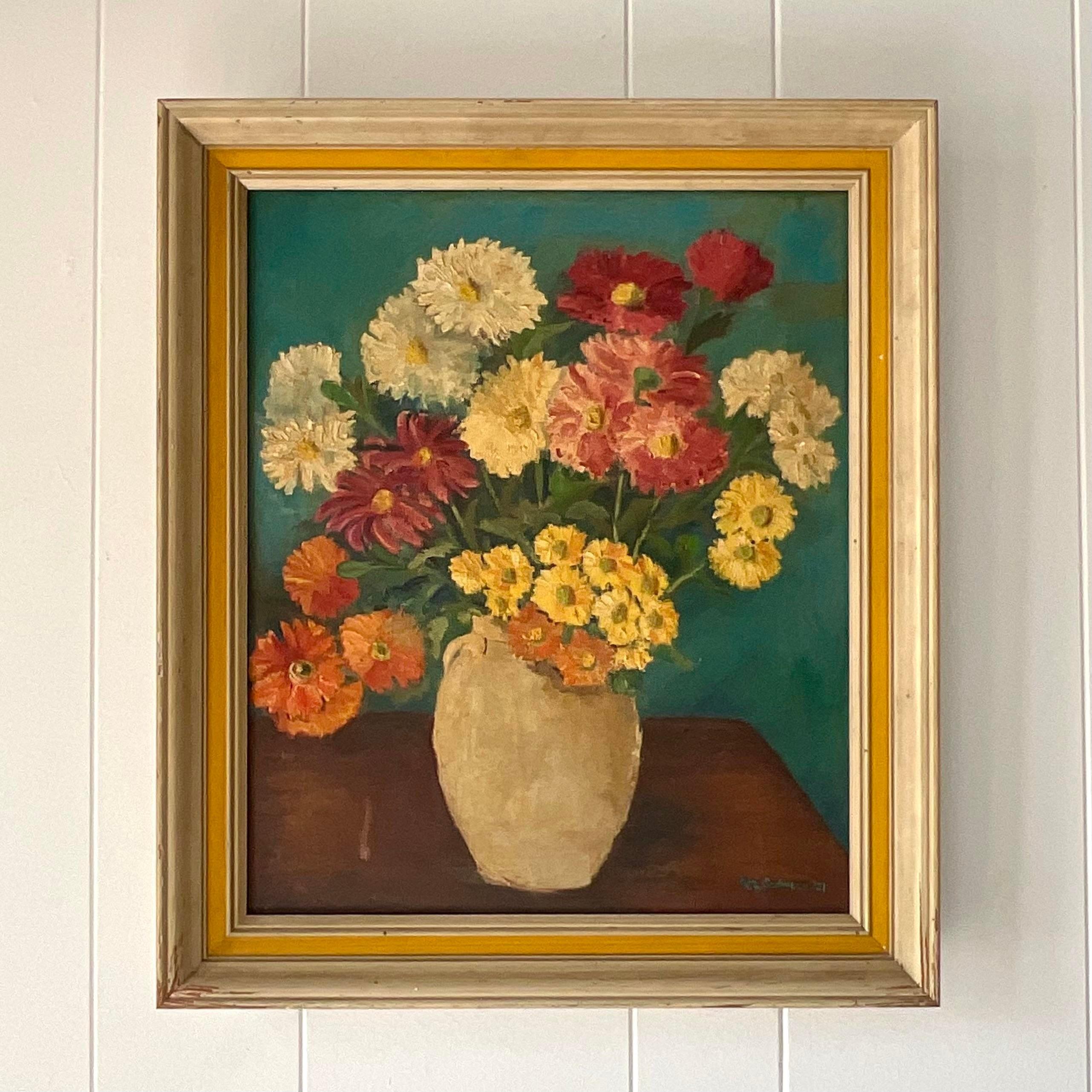 A fantastic vintage Coastal original oil on canvas. A beautiful floral composition in warm rich colors. A chic period frame in white and yellow. Signed and dated by the artist. Acquired from a Palm Beach estate.