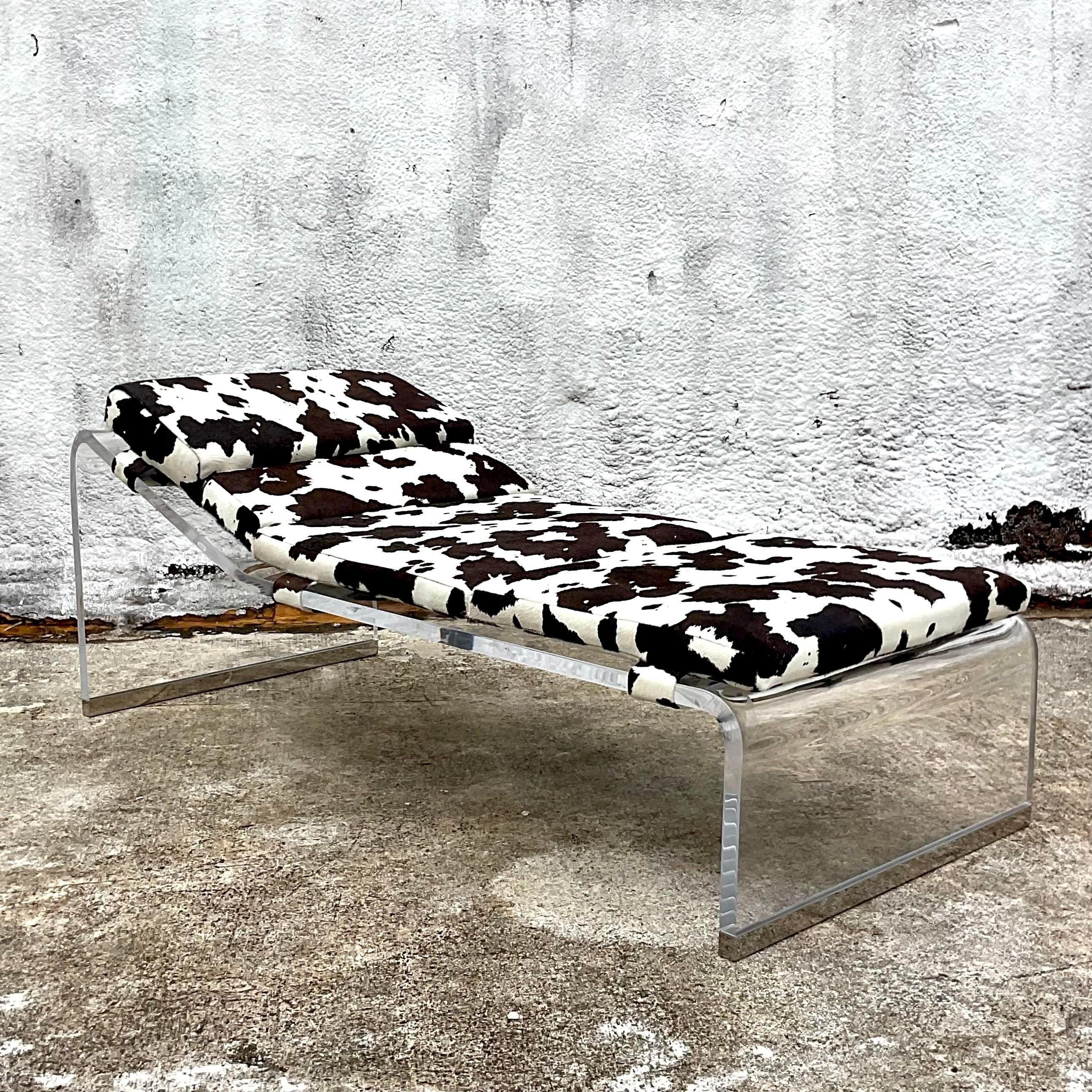 A fantastic vintage Boho chaise lounge. A chic molded slab lucite with polished chrome end caps. A custom pony skin cushion with Velcro straps. Acquired from a Palm Beach estate.