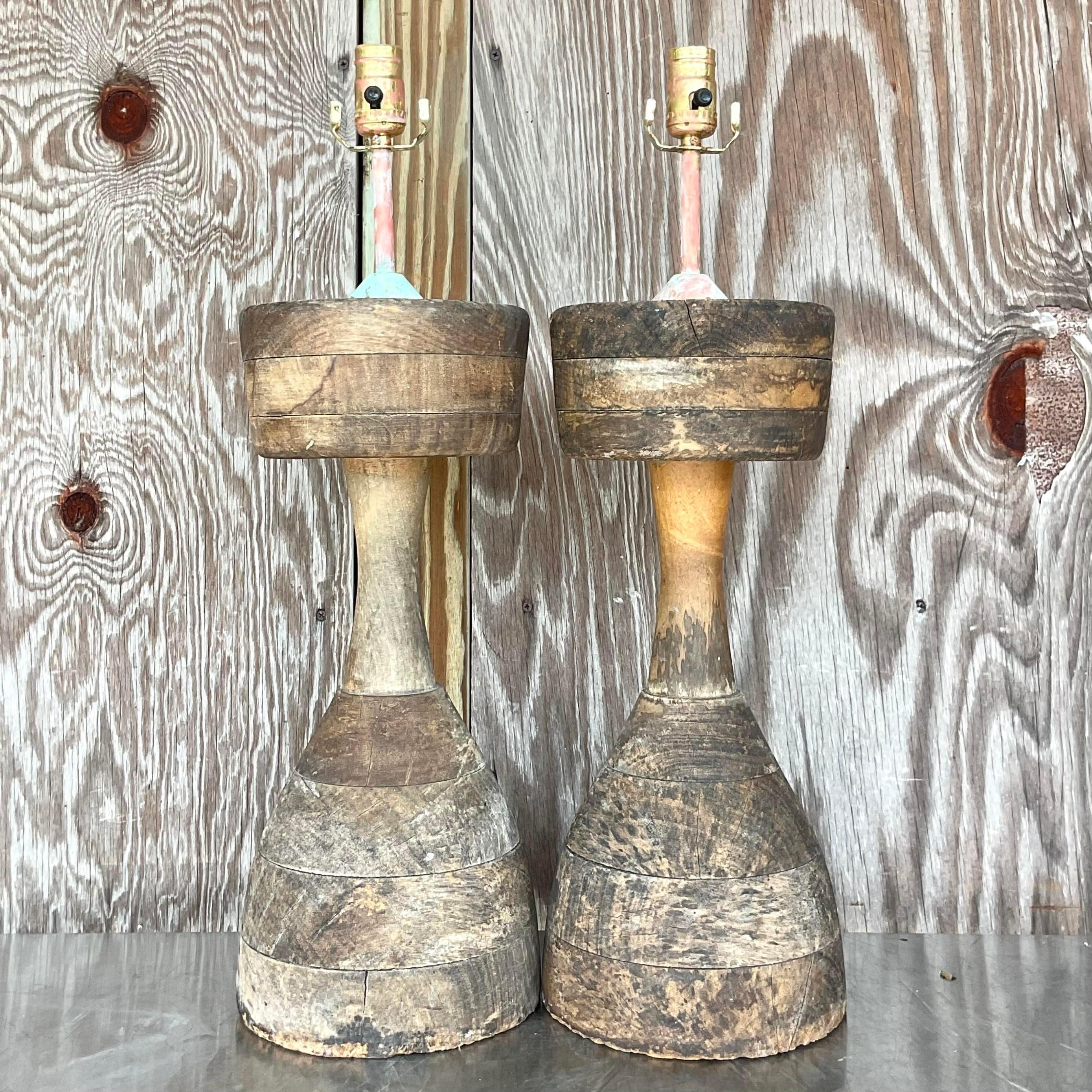 A striking pair of vintage Boho wood lamps. Chic turned wood with a weathered finish. Hand painted hardware really adds to the overall artisan look. Acquired from a Palm Beach estate. 