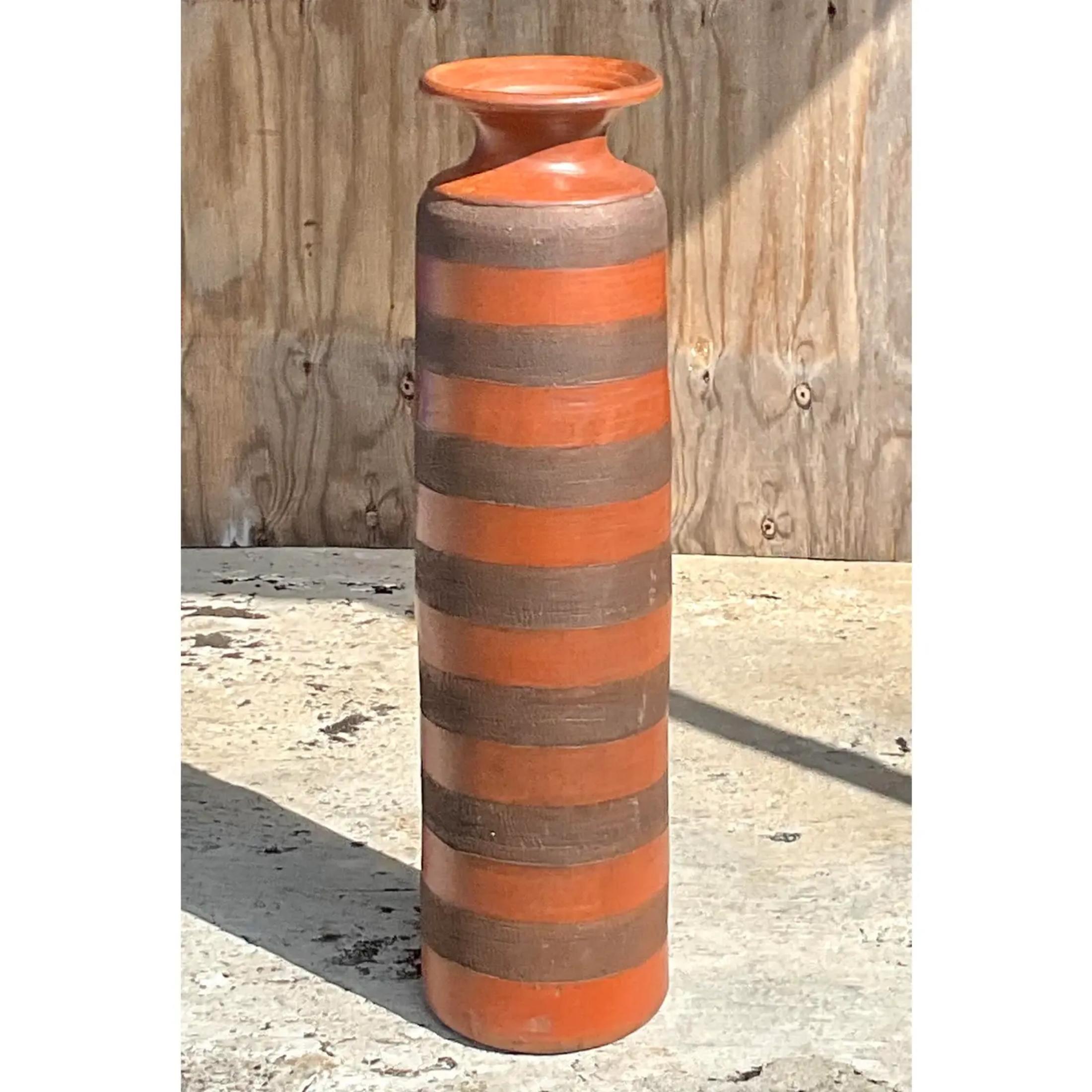 Fabulous vintage large pottery floor vase. Chic striped design in rich warm color. Tall and impressive. Acquired from a Palm Beach estate.
