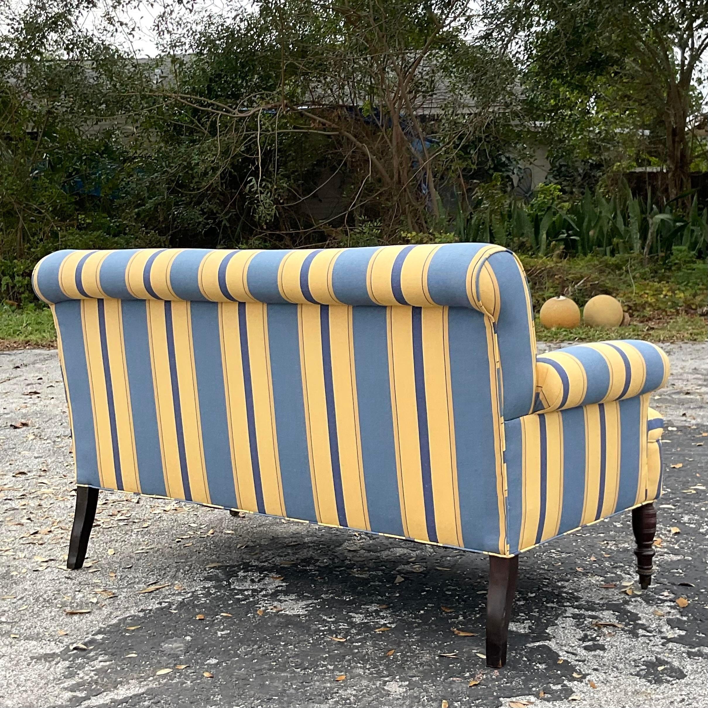 A fantastic vintage Boho sofa. A super chic striped upholstery on a classic sofa style. Beautiful turned wood front legs. Acquired from thr collection of the iconic Lars Bolander.