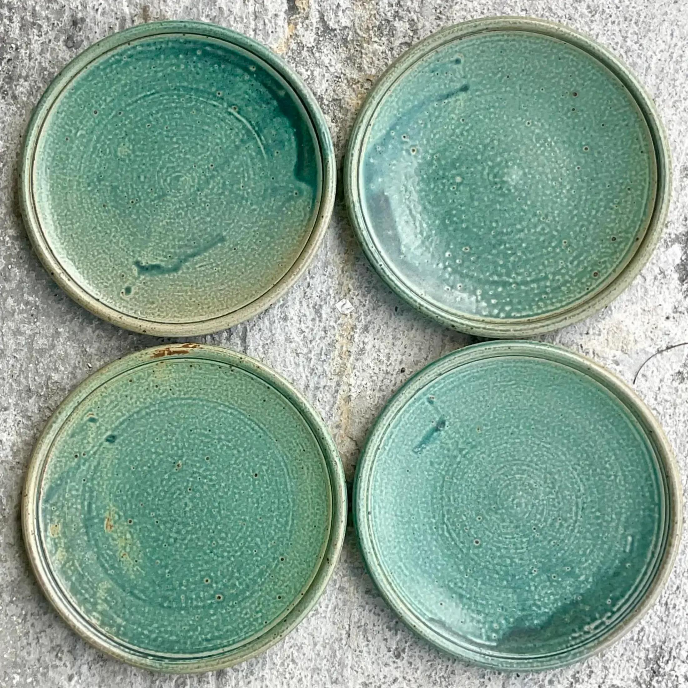 A fabulous set of 8 gorgeous dinner and salad plates. Super chic hand made studio pottery in thr most beautiful shade of green. Four dinner plates and four salad plates. Acquired from a Palm Beach estate.