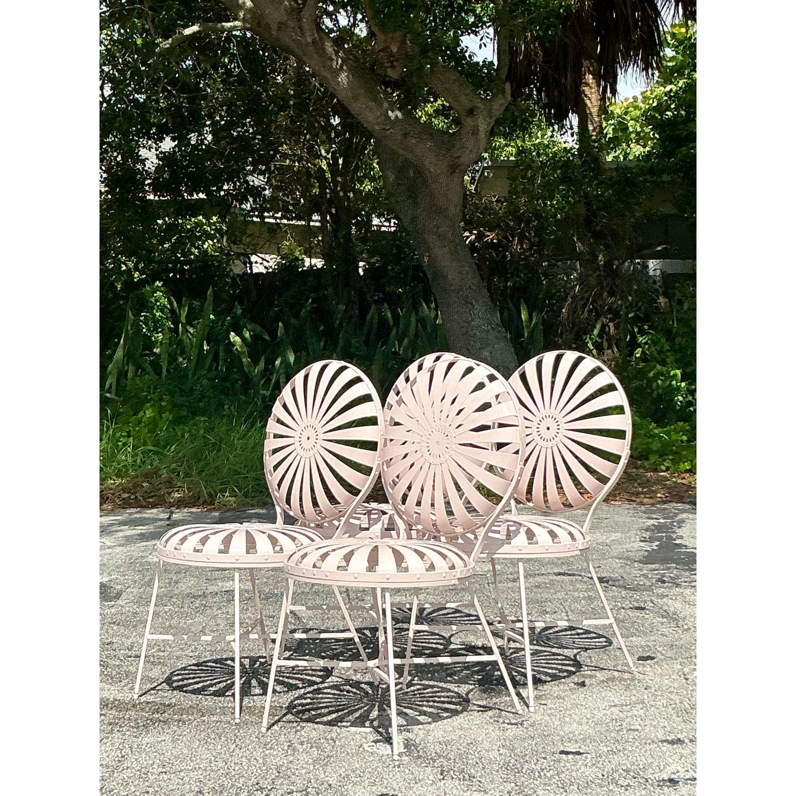Capture the timeless charm of a Parisian garden with this exceptional set of five 