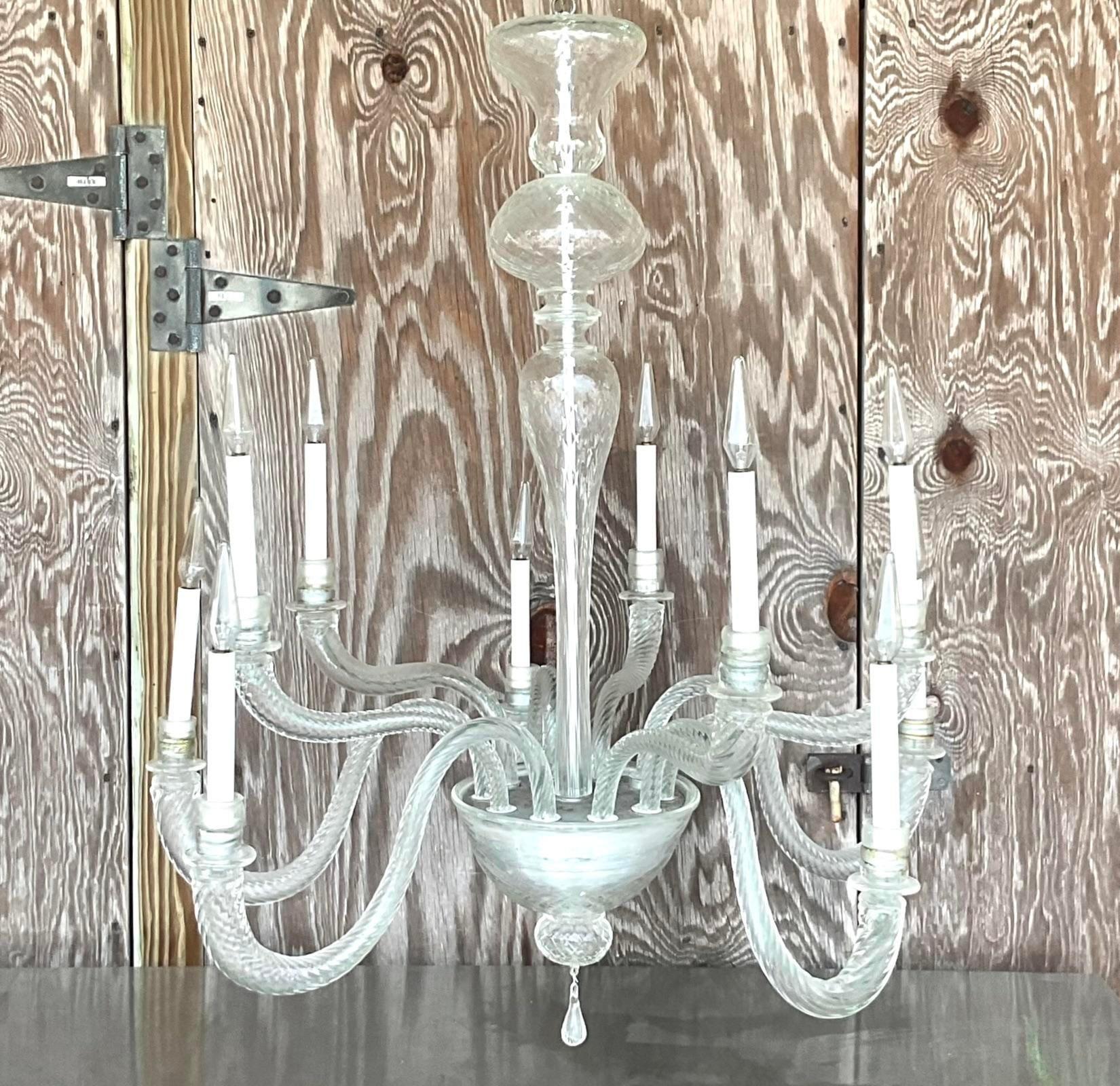 A stunning vintage Boho blown glass chandelier. Done in the manner of Murano. Beautiful swirl design in the lightly opaque glass. Acquired from a Palm Beach estate.