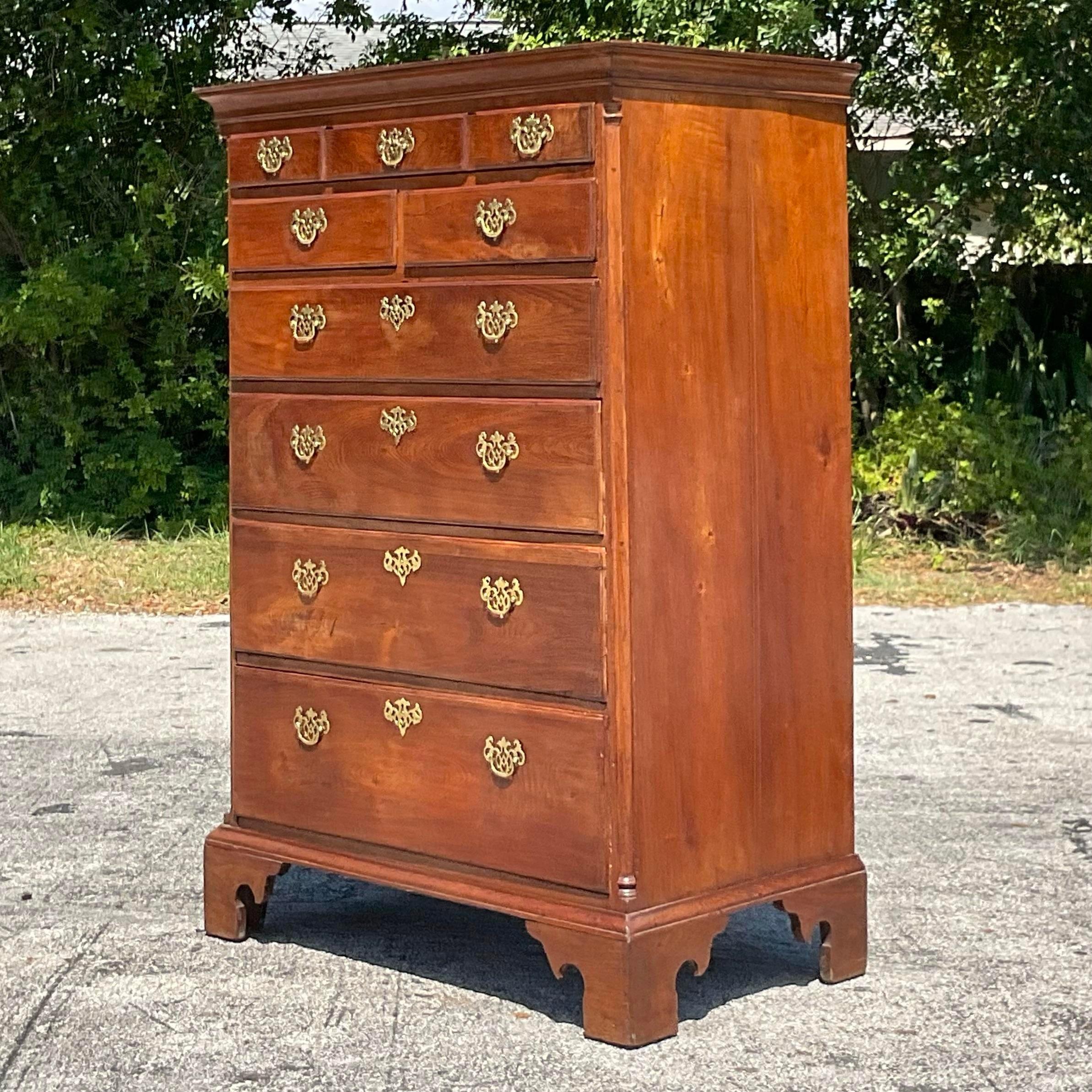 Add a touch of eclectic charm to your space with this Vintage Boho Tall Chest of Drawers. This American-made piece features unique detailing and ample storage, perfectly blending bohemian flair with practical functionality for a standout addition to