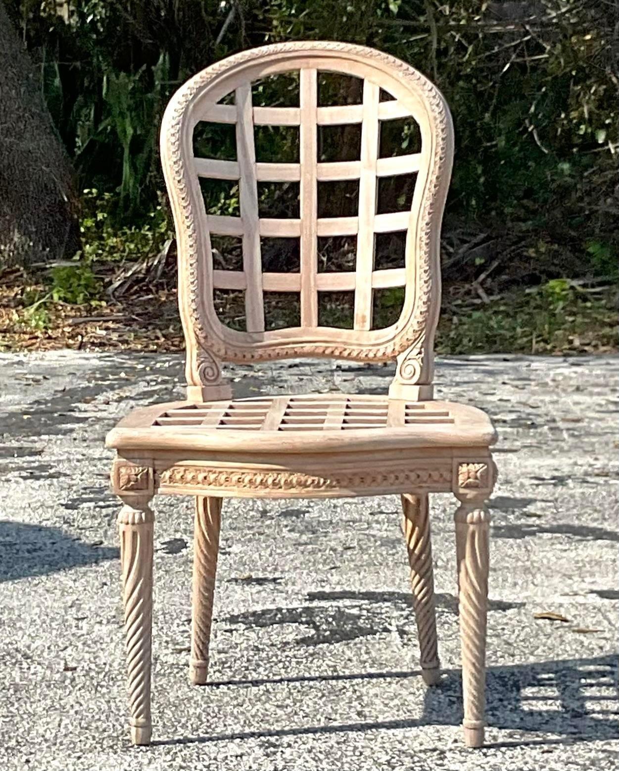 A fabulous vintage Boho carved side chair. A handsome teak construction in a classic trellis design. Perfect as a chic desk chair or addition seating. You decide! Acquired from a Palm Beach estate. 