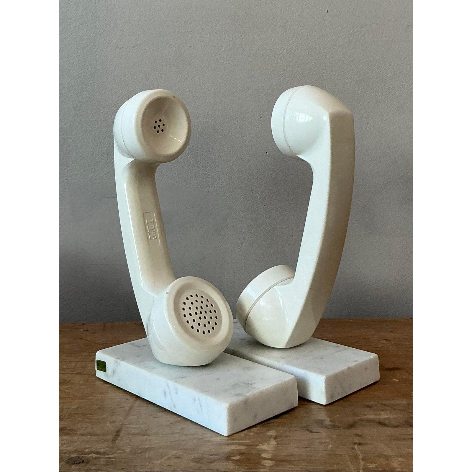 Infuse your library or office with a touch of whimsical nostalgia and sophisticated design with this captivating set of vintage Boho telephone bookends. This unique pair reimagines classic telephone handsets as functional art, mounted on elegant