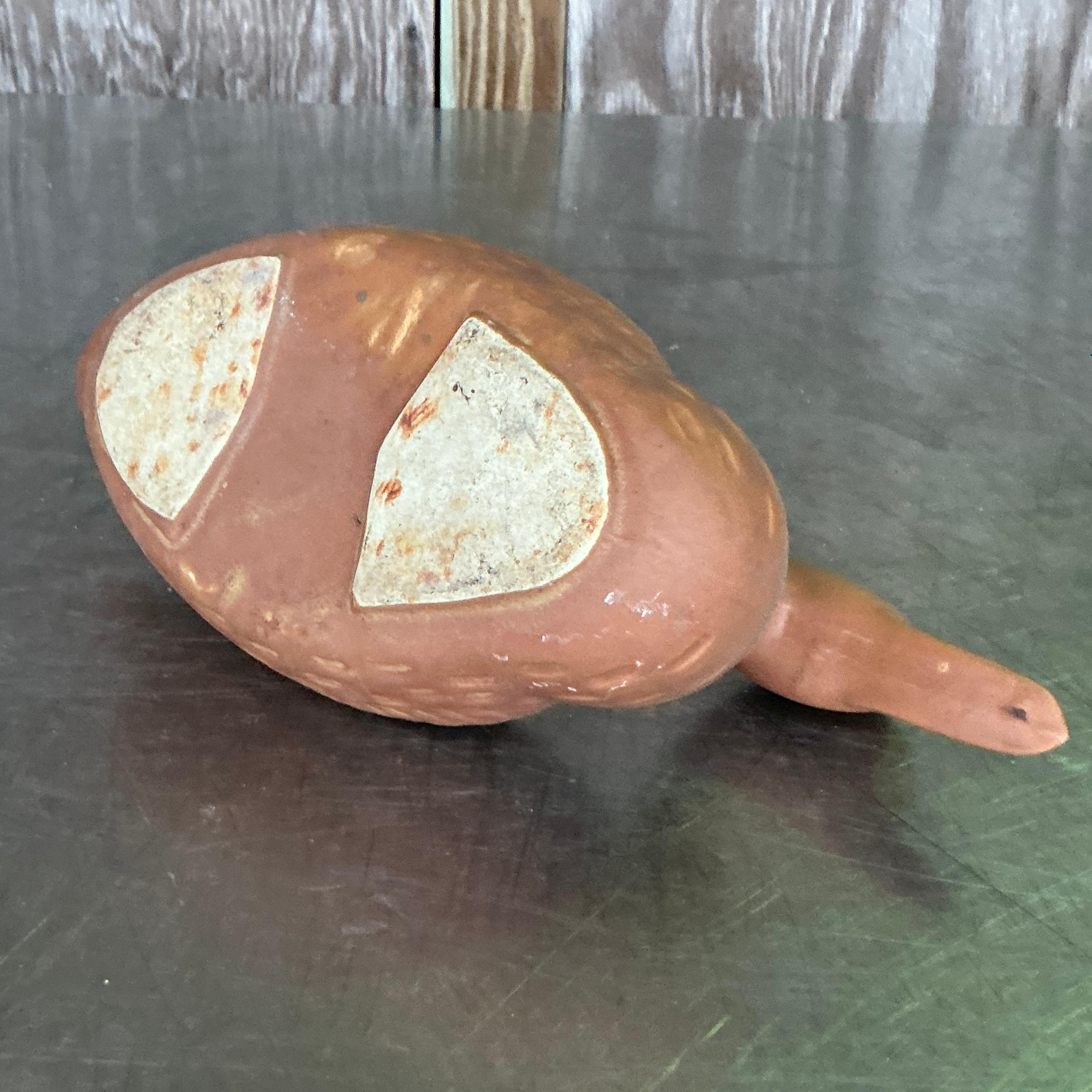 Enhance your home decor with this Vintage Boho Terracotta Duck Planter. Perfectly embodying American rustic charm, this unique piece adds a whimsical touch to any space. Ideal for succulents or small plants, its earthy tones and bohemian flair make