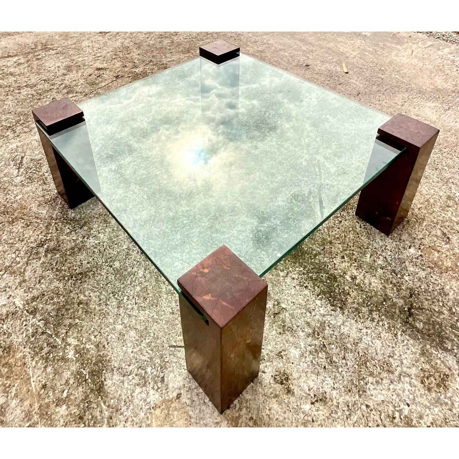 Vintage Boho coconut shell coffee table. A super sleek and minimal design with four Coconut shell pedestals. The thick glass slides neatly into the pedestals. Acquired from a Palm Beach estate.