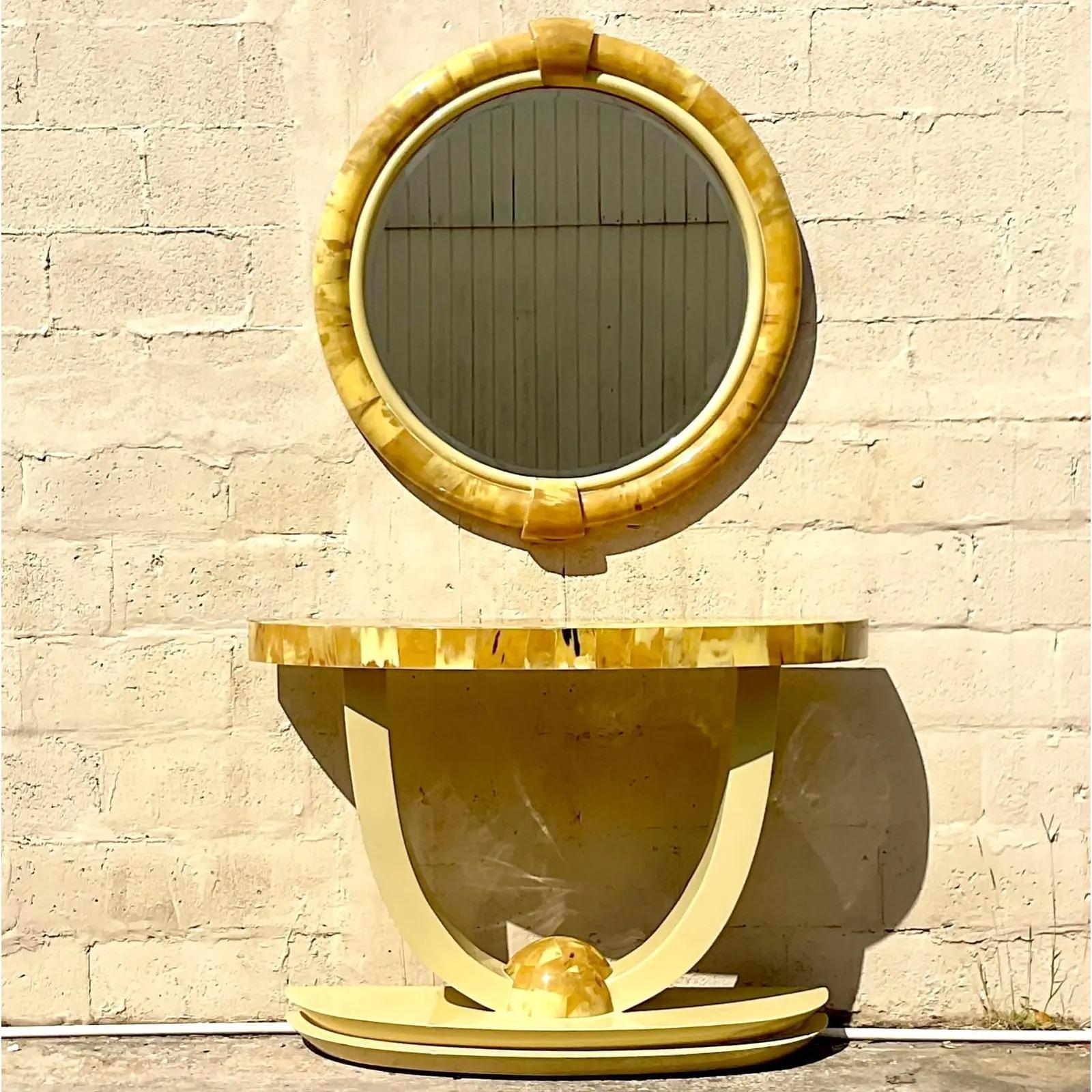 An extraordinary vintage console table set. A chic tessellated horn with a demilune console and coordinating mirror. Done in the manner of Enrique Garcel. Beautiful patina from time. Two sets available if your project needs a pair. 

Mirror