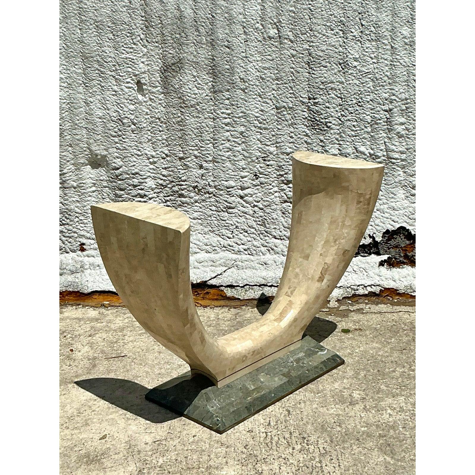 Elevate your interior with the sophisticated texture and sculptural form of this vintage tessellated stone console table. A hallmark of chic 1980s and Postmodern design, this piece features a striking U-shaped pedestal base meticulously clad in