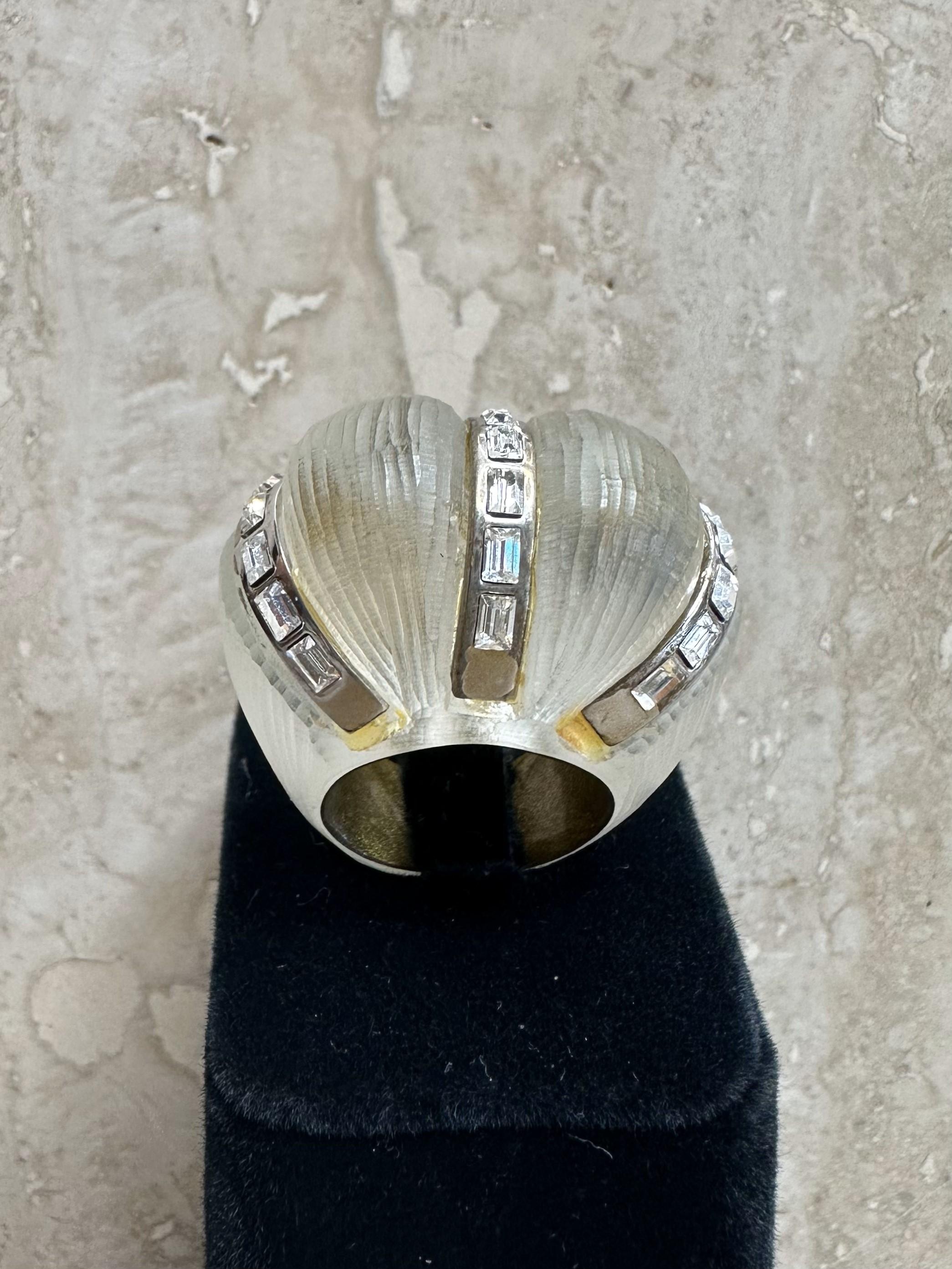 A Vintage Boho Textured Lucite Ring with Rhinestones is a unique and eye-catching piece of jewelry that combines the earthy bohemian aesthetic with the bold, artistic use of Lucite and the sparkle of rhinestones. This type of ring often showcases an