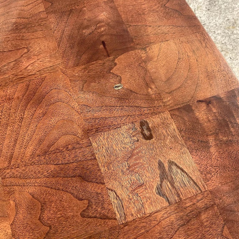 A fantastic vintage Boho burl wood Parsons dining table. Made by the iconic Thayer Coggin and tagged on the bottom. Beautiful checkerboard design in rich warm colors. Two leaves included for a possible 104 inches! Acquired from a Palm Beach estate
