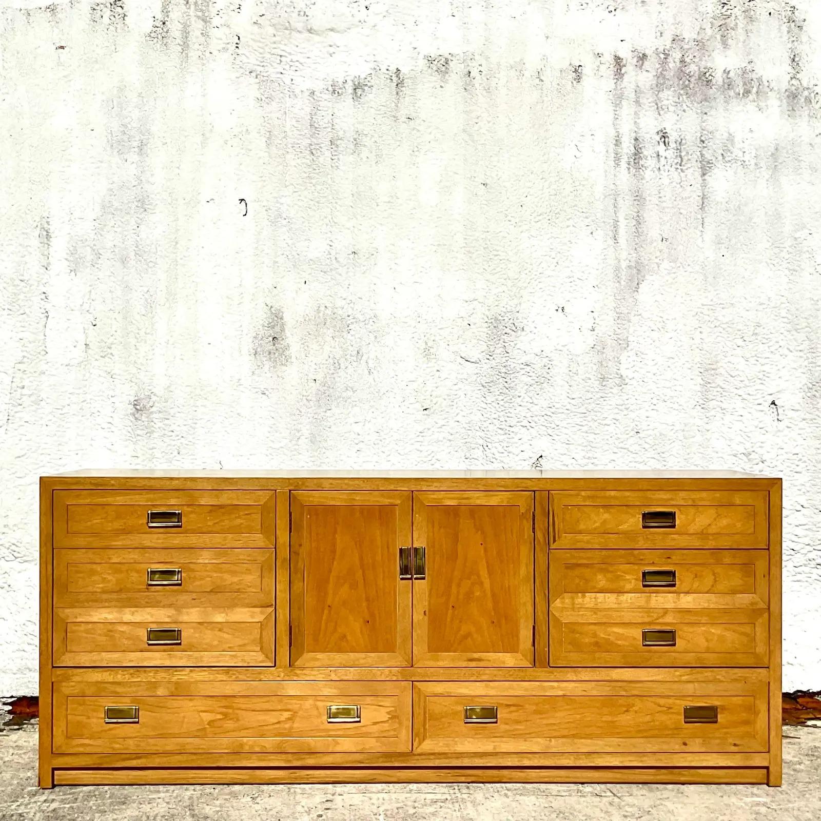 Fabulous vintage Boho dresser. Beautiful light wood with a chic and simple design. Brass hardware. Made by the legendary Thomasville group. Acquired from a Palm Beach estate