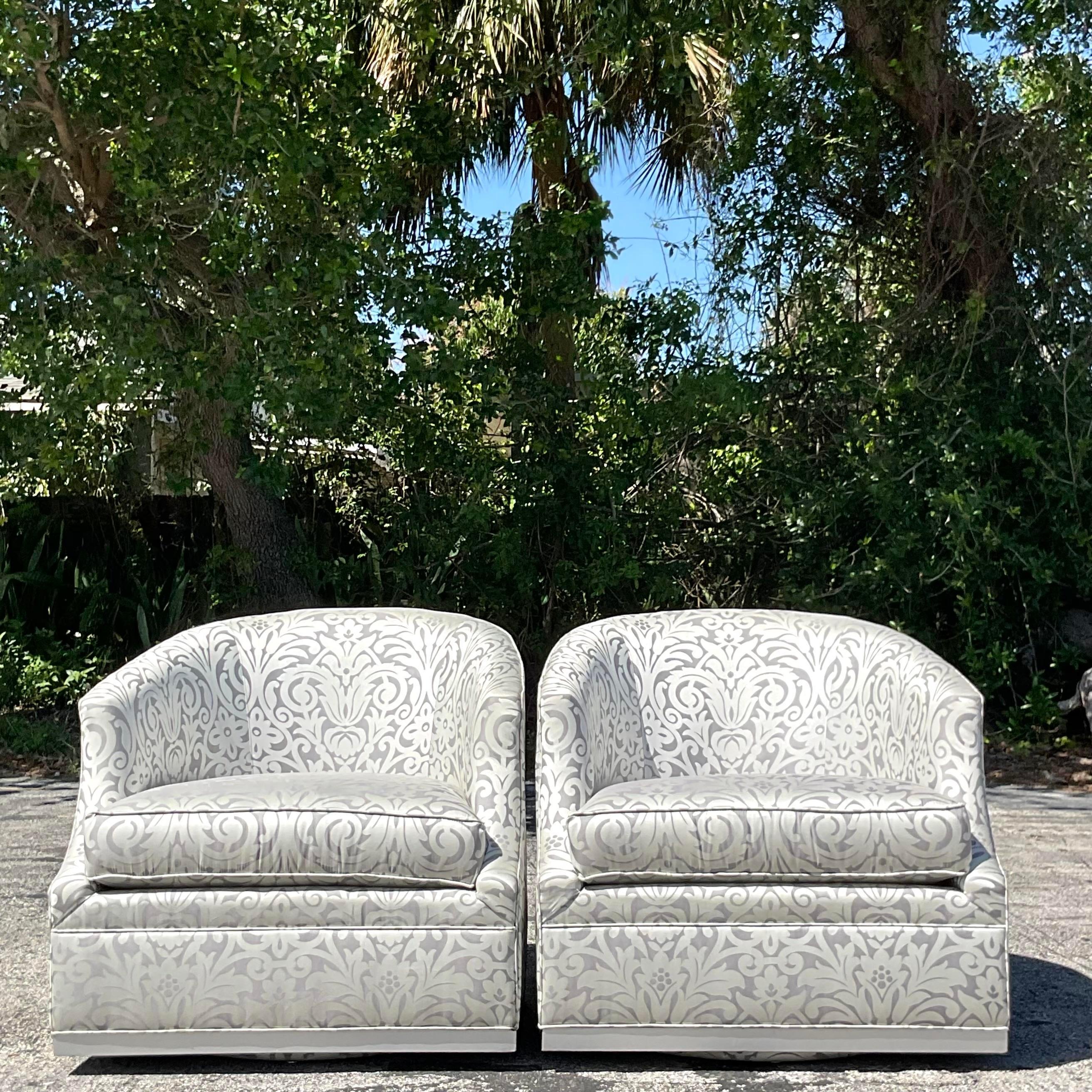 Transform your living space with our Vintage Boho Thomasville Metallic Jacquard Swivel Chairs, epitomizing the essence of American craftsmanship and style. Crafted with intricate metallic jacquard patterns, these chairs effortlessly blend vintage