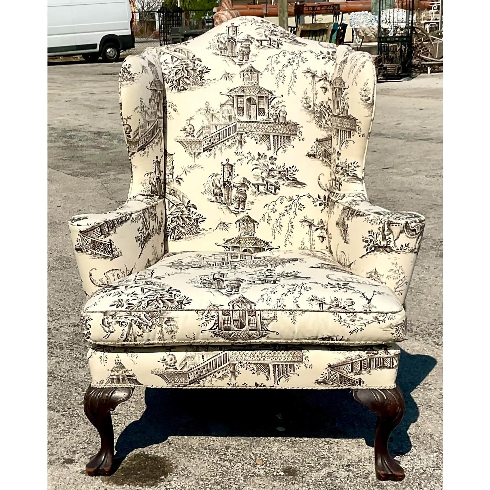 A fantastic vintage Boho Chair. A chic black and white toile print on a classic wingback chair. Carved cabriolet legs. Big and roomy it is the perfect reading chair. Acquired from a Palm Beach estate.