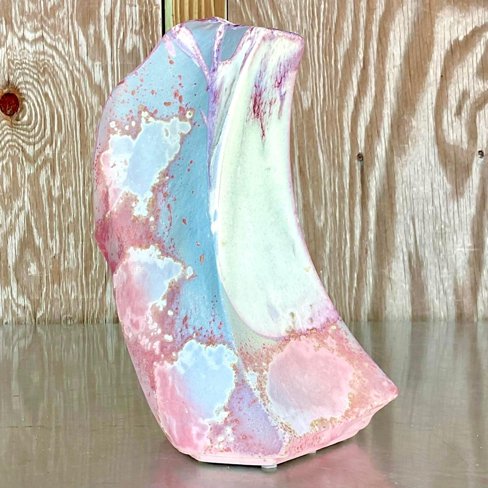 A fantastic vintage Boho pottery vase. Made by the iconic Tony Evans and signed on the bottom. Beautiful Raku fired finish in brilliant shades of pink. Acquired from a Palm Beach estate.
