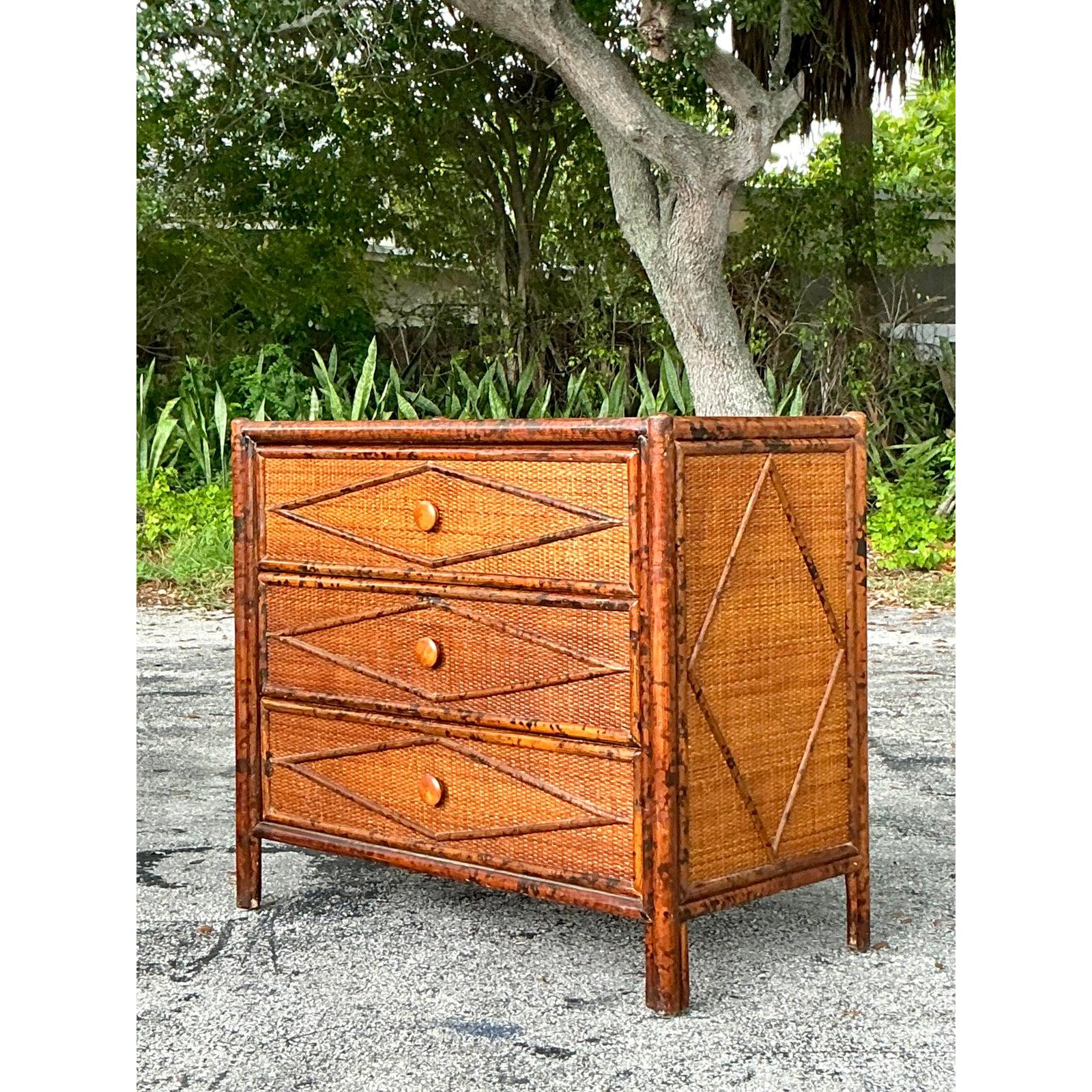 Infuse your interior with irresistible bohemian charm with this vintage tortoise shell finished chest of drawers. The exquisite diamond motif, meticulously crafted from rich bamboo and rattan, creates a captivating visual texture, while the