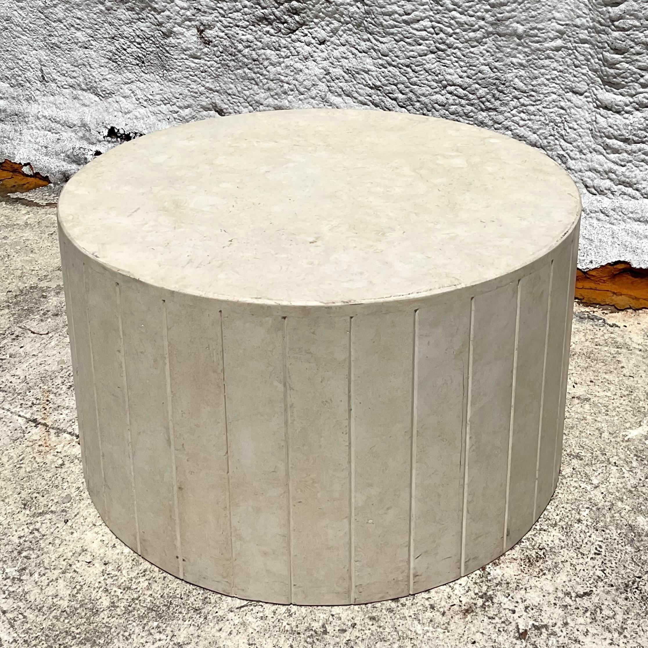 Elevate your space with this Vintage Boho Travertine Drum Table. Featuring a natural travertine stone top and a unique drum design, this table brings bohemian charm and earthy elegance to any room. Perfect for adding a stylish, organic touch to your