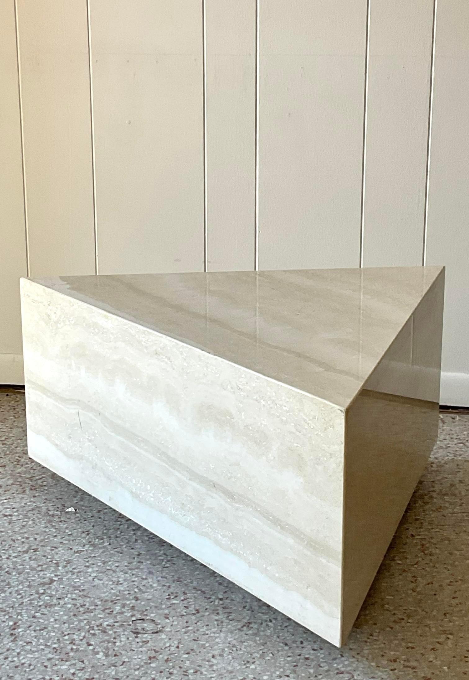 The Vintage Boho Triangle Travertine Side Table beautifully embodies American bohemian style with its unique triangular shape and natural travertine surface. This side table combines earthy elegance with artistic design, making it a perfect addition