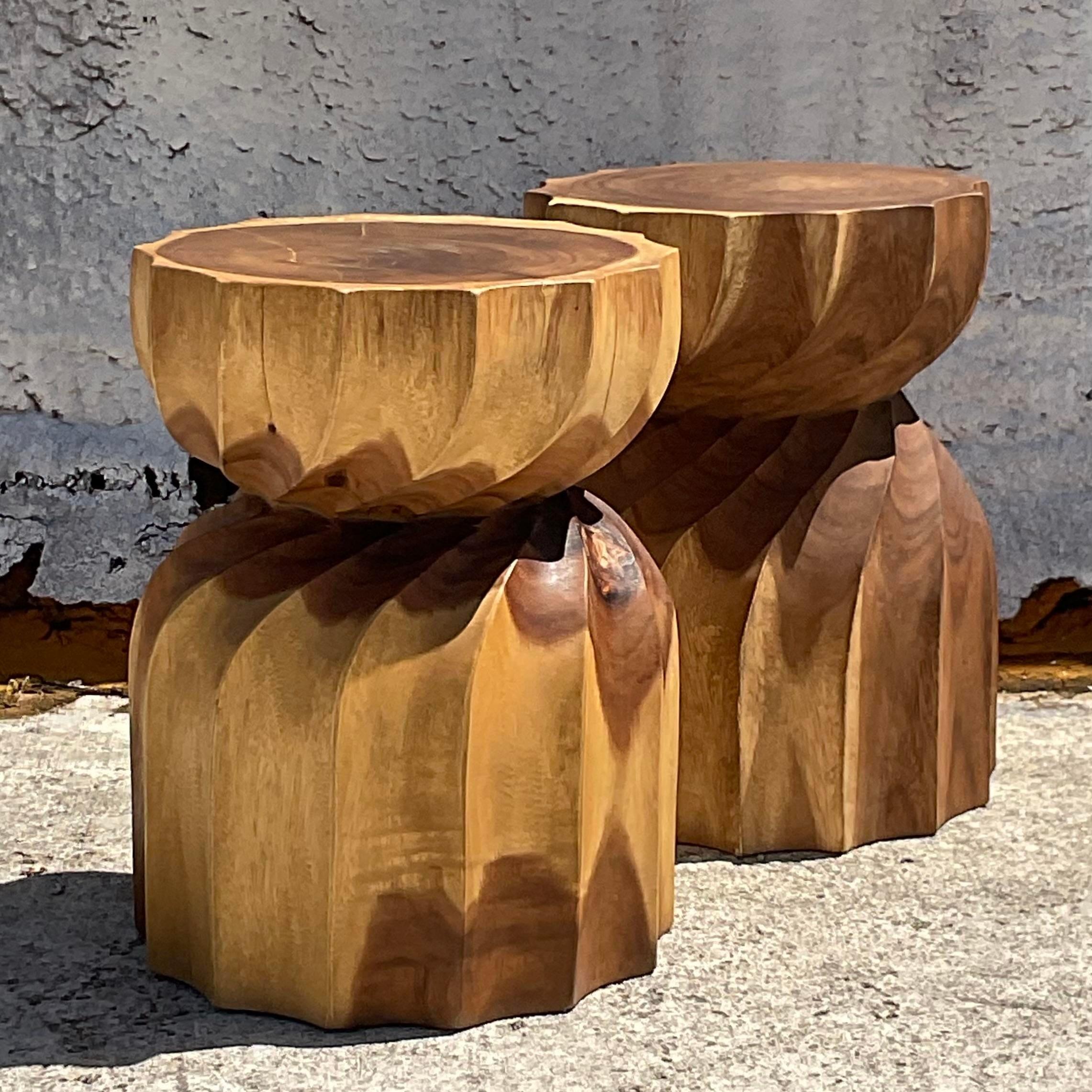 Infuse your home with rustic charm using this Pair of Vintage Boho Twisted Stump Low Stools, a quintessential representation of American style. Crafted with natural beauty in mind, these stools feature twisted stump designs that evoke a sense of