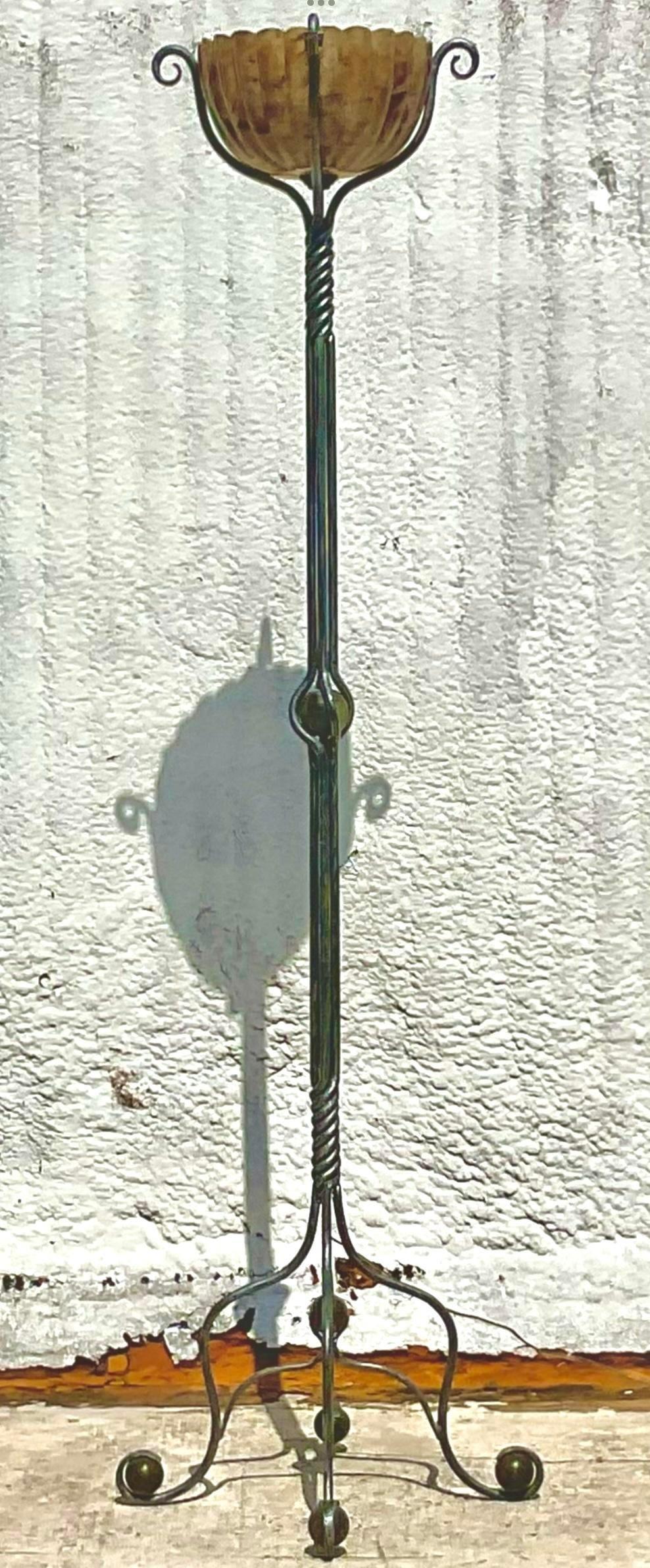 Illuminate your space with the unique charm of this Vintage Boho Twisted Wrought Iron and Pen Shell Floor Lamp. Perfect for American-style interiors, this floor lamp features an intricately twisted wrought iron base paired with a beautifully crafted
