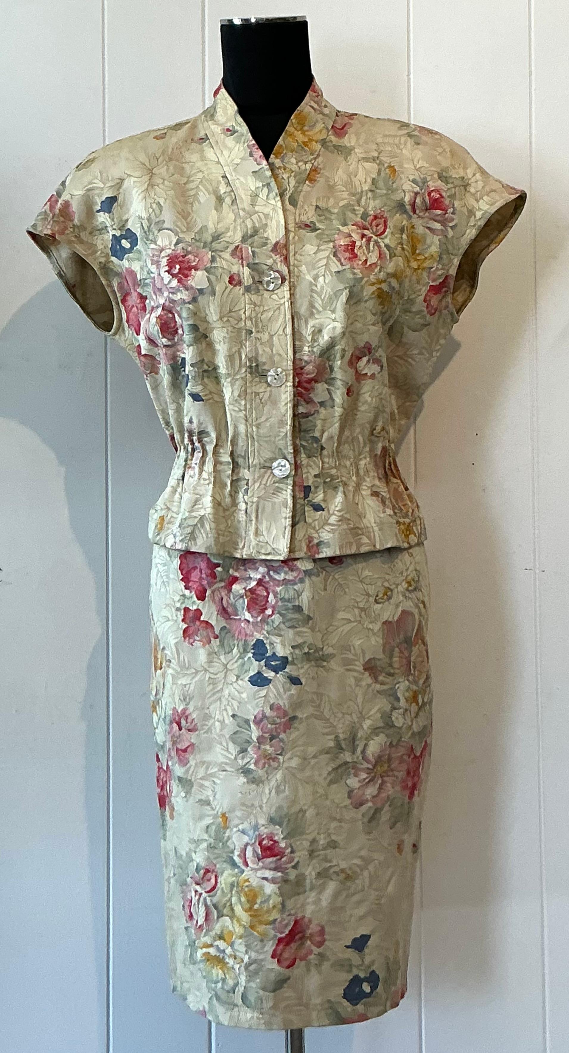 This vintage boho Emanuel Ungaro beige floral set is a dreamy expression of romantic femininity and effortless sophistication. Likely dating from the 1970s or 1980s, the set includes a flowing blouse and matching skirt or trousers, crafted from
