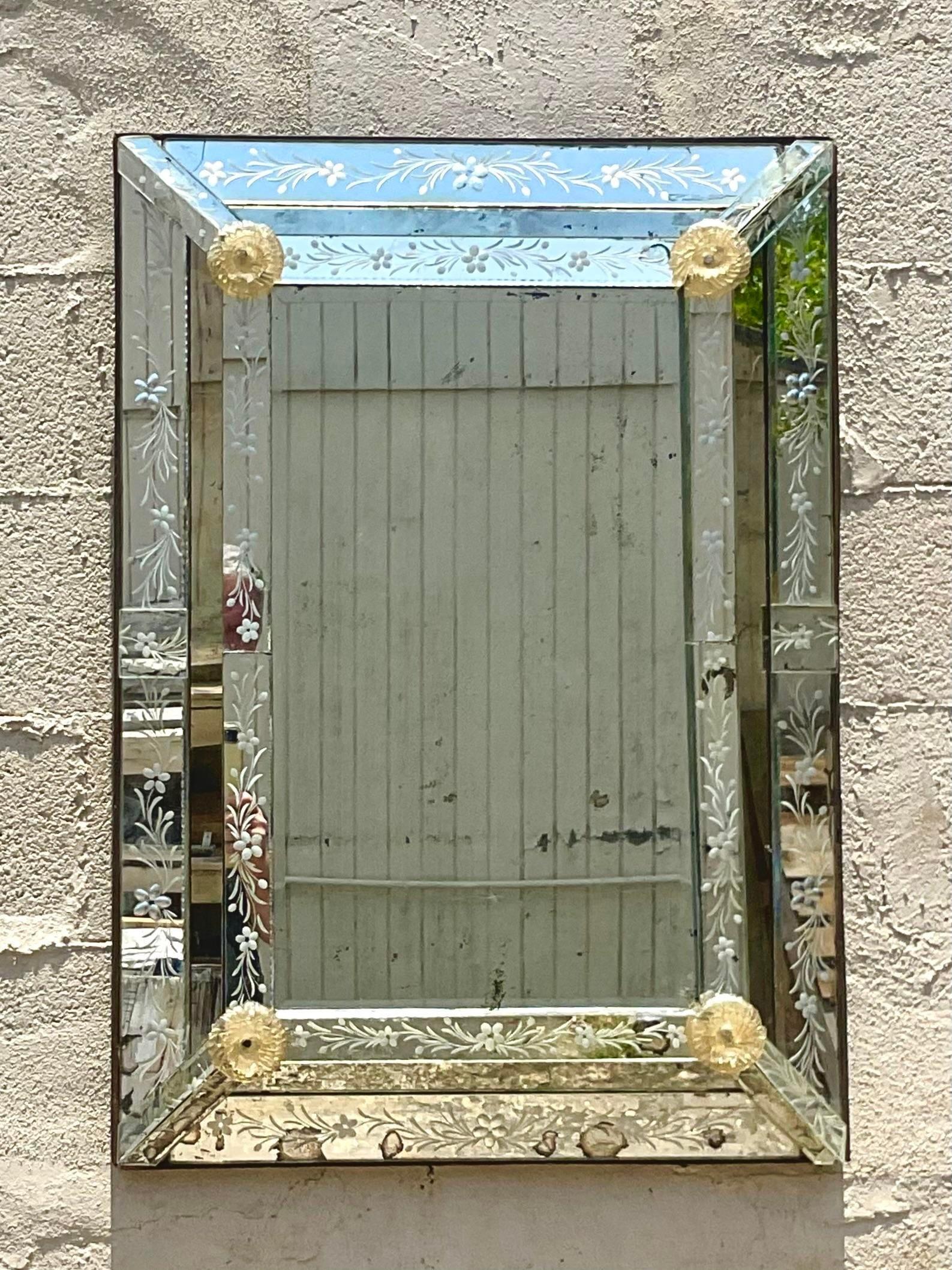 A fabulous vintage Boho wall mirror. A chic antique etched glass mirror with beautiful etching detail. Hand blow rosettes in a pale yellow. This mirror shows all its patina with missing foil and cracks to the glass. But it adds to the romantic
