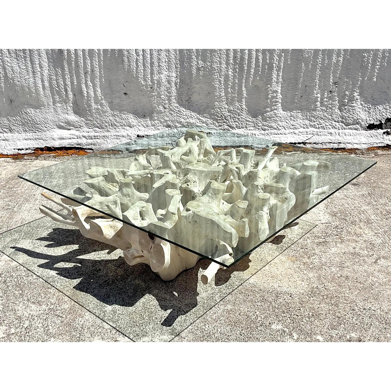 A spectacular vintage Coast pal coffee table. A chic monumental Teak roof pedestal with a thick glass top. Made by the coveted Walker Zabriskie in Palm Beach. Acquired from a Palm Beach estate.