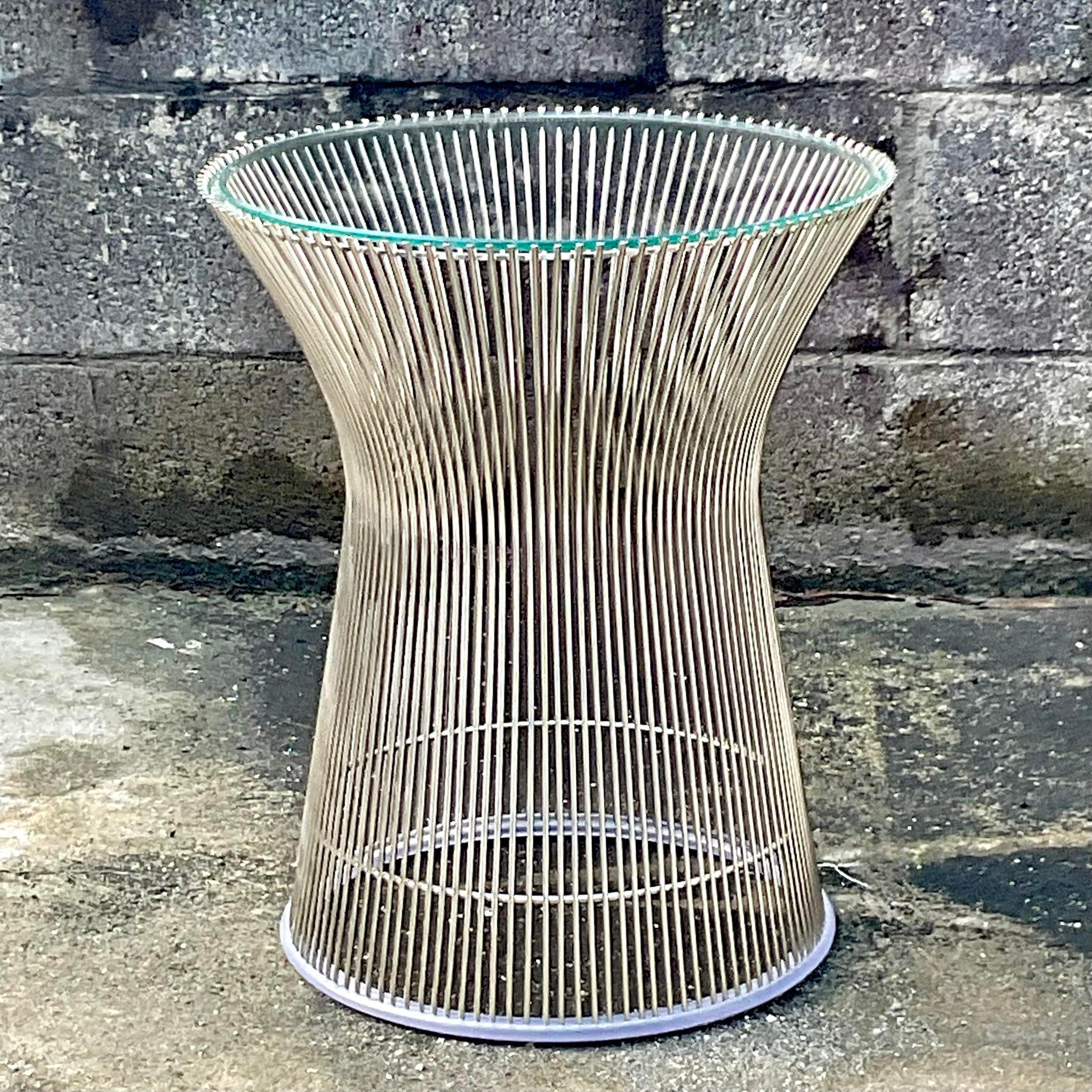 A fabulous vintage Boho side table. Made by the iconic Warren Platner for Knoll. Chrome frame with an inset glass top. Unmarked. Acquired from a Miami estate.
